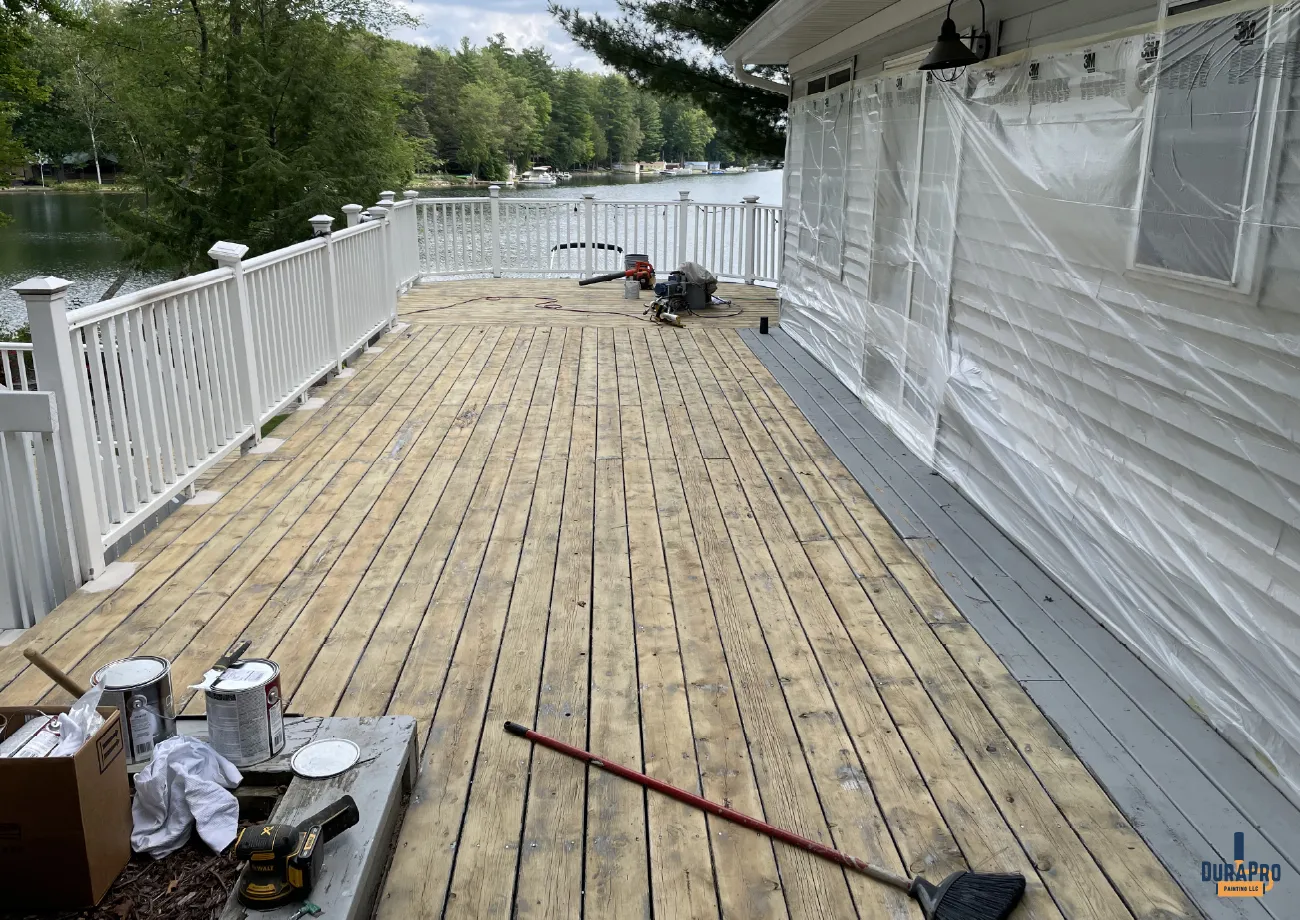 Beginning stages of deck staining process on a lakefront home in Michigan by DuraPro Painting