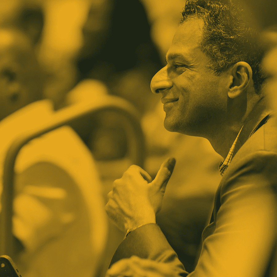 Executives’ Club Workforce Summit promotional image showing an attendee listening.