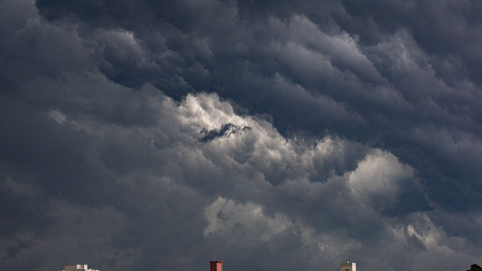 Weather storm clouds city street.