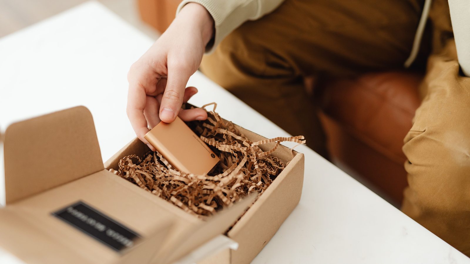 Unboxing new product hands table.