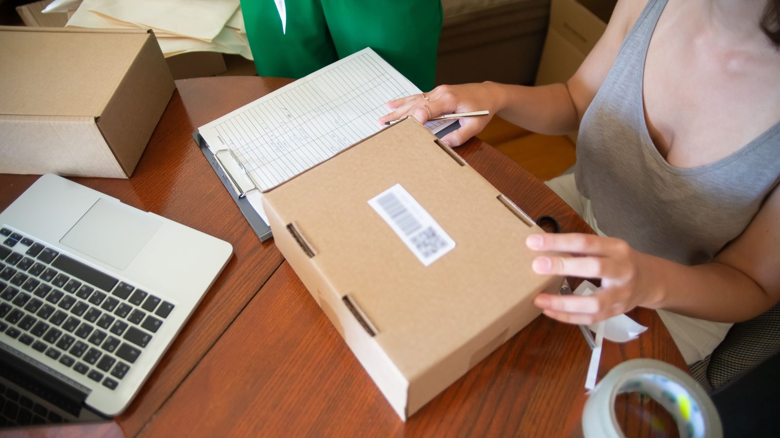 Entrepreneur packing parcels home.