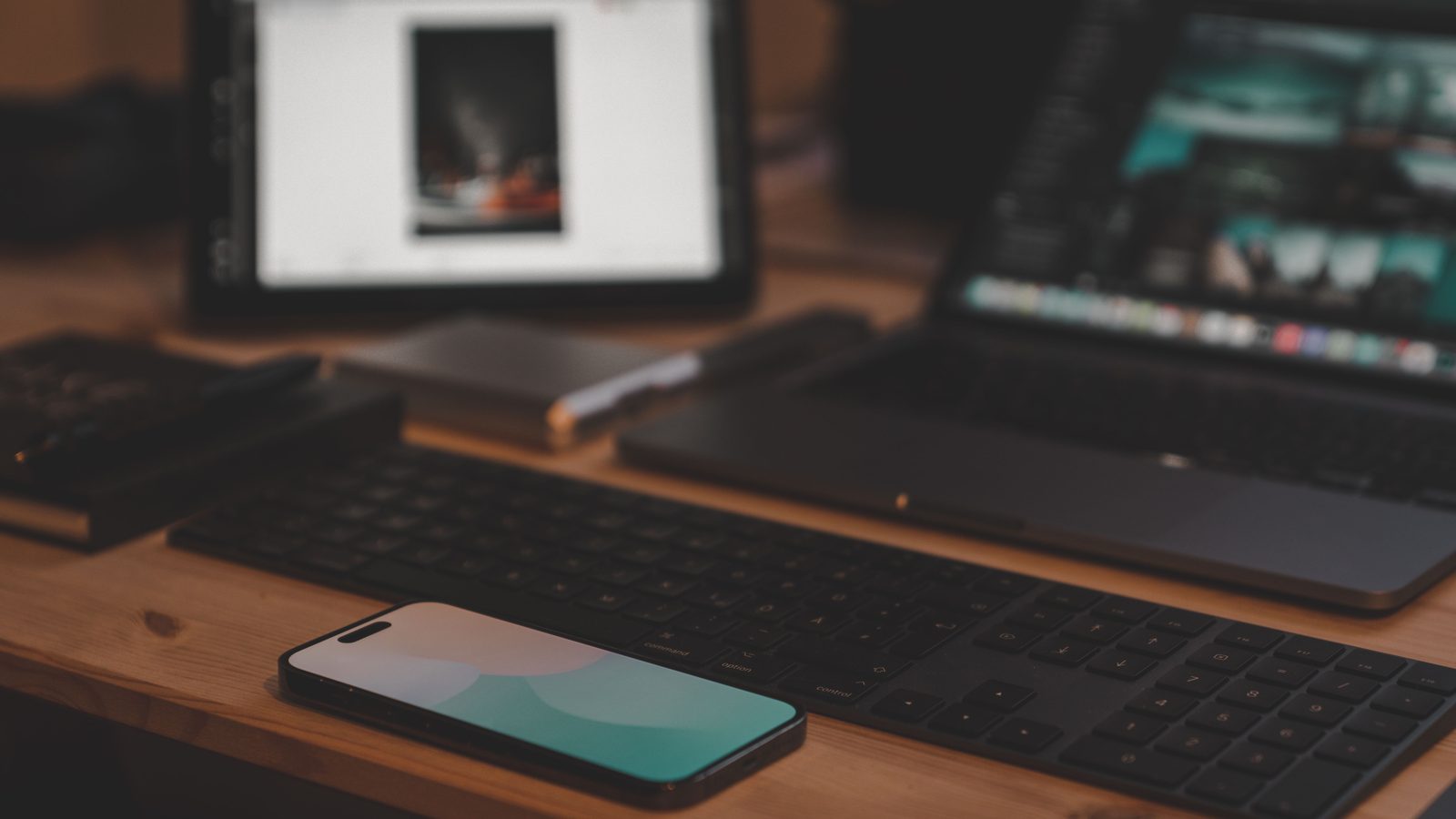 Laptop phone tablet devices desk.