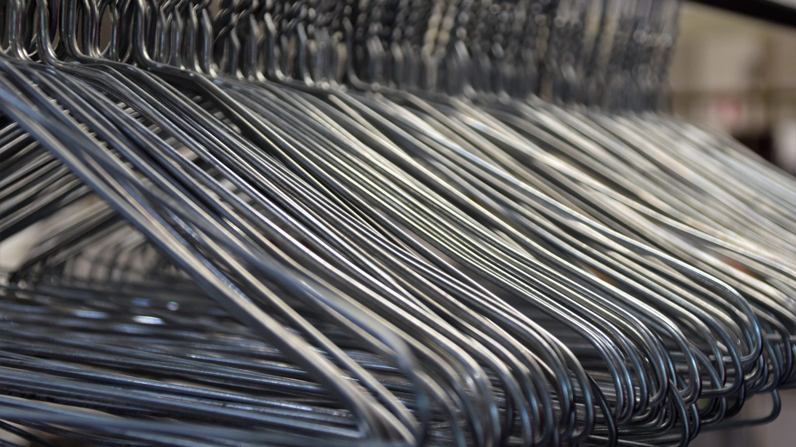 Empty clothing hangers rack shop.