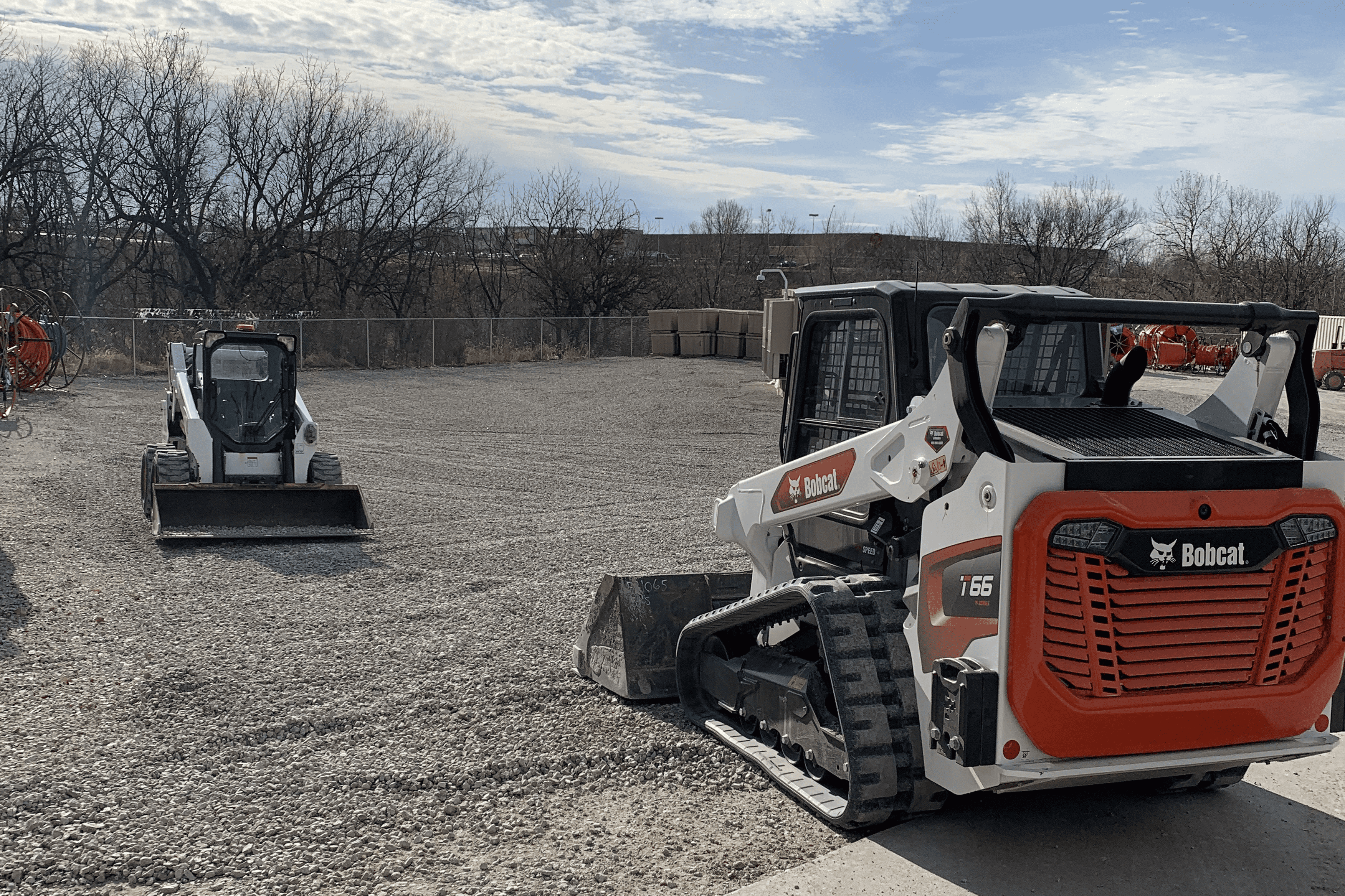 Nick's Lawn Care skid loader equipment operating on a job site in Omaha, NE