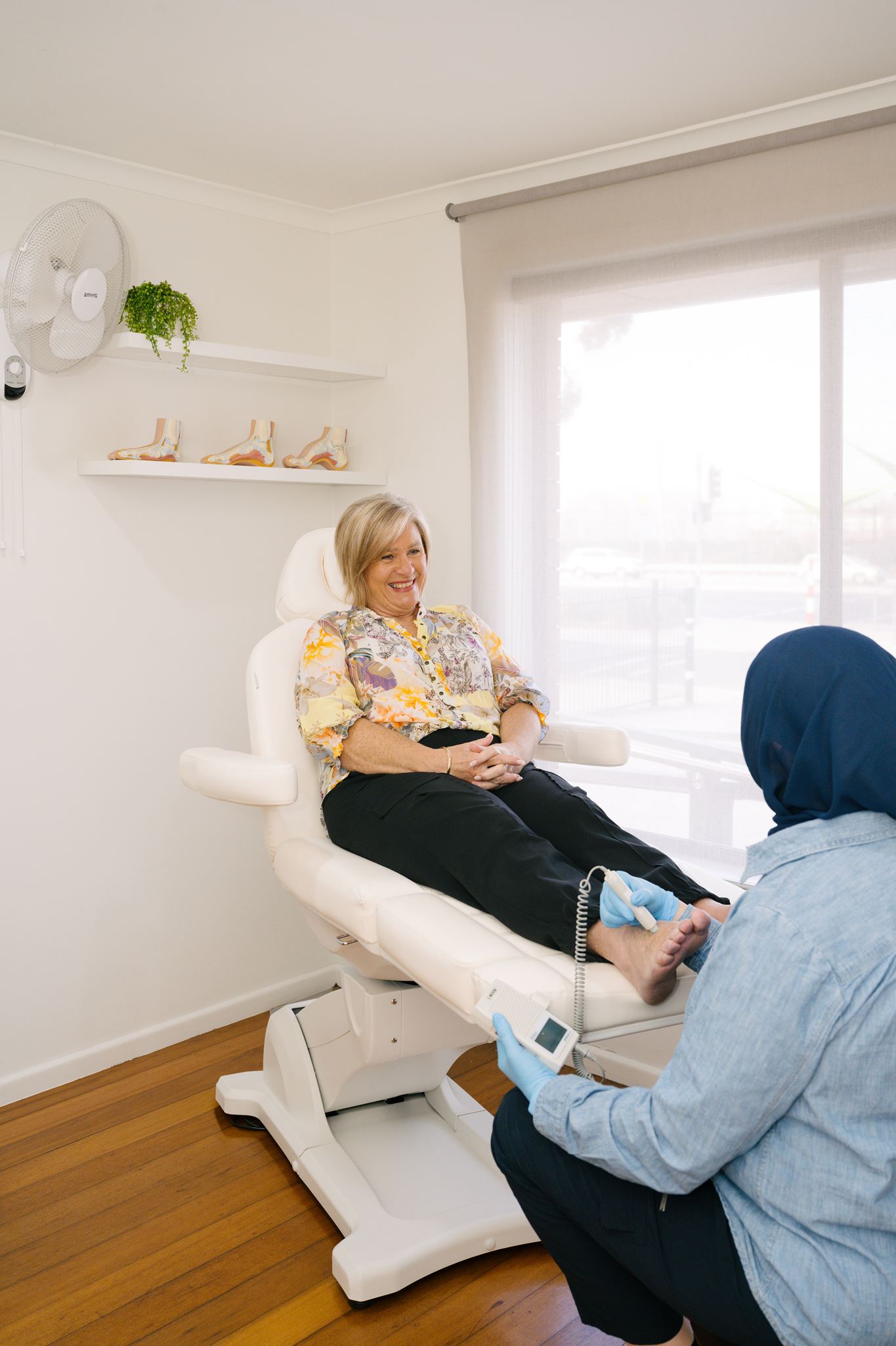 Undefeeted Podiatry — podiatrist reviewing assessment results with patient