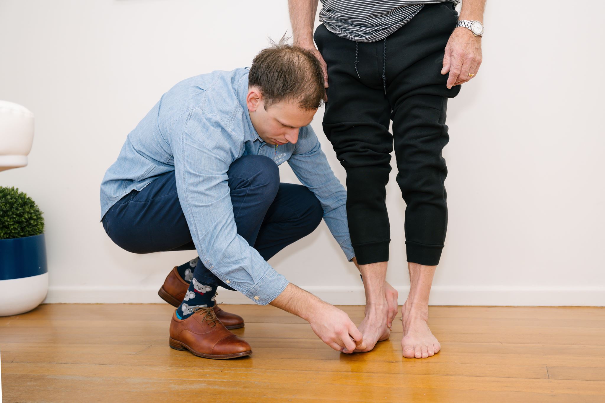 Podiatrist examining a patient's foot