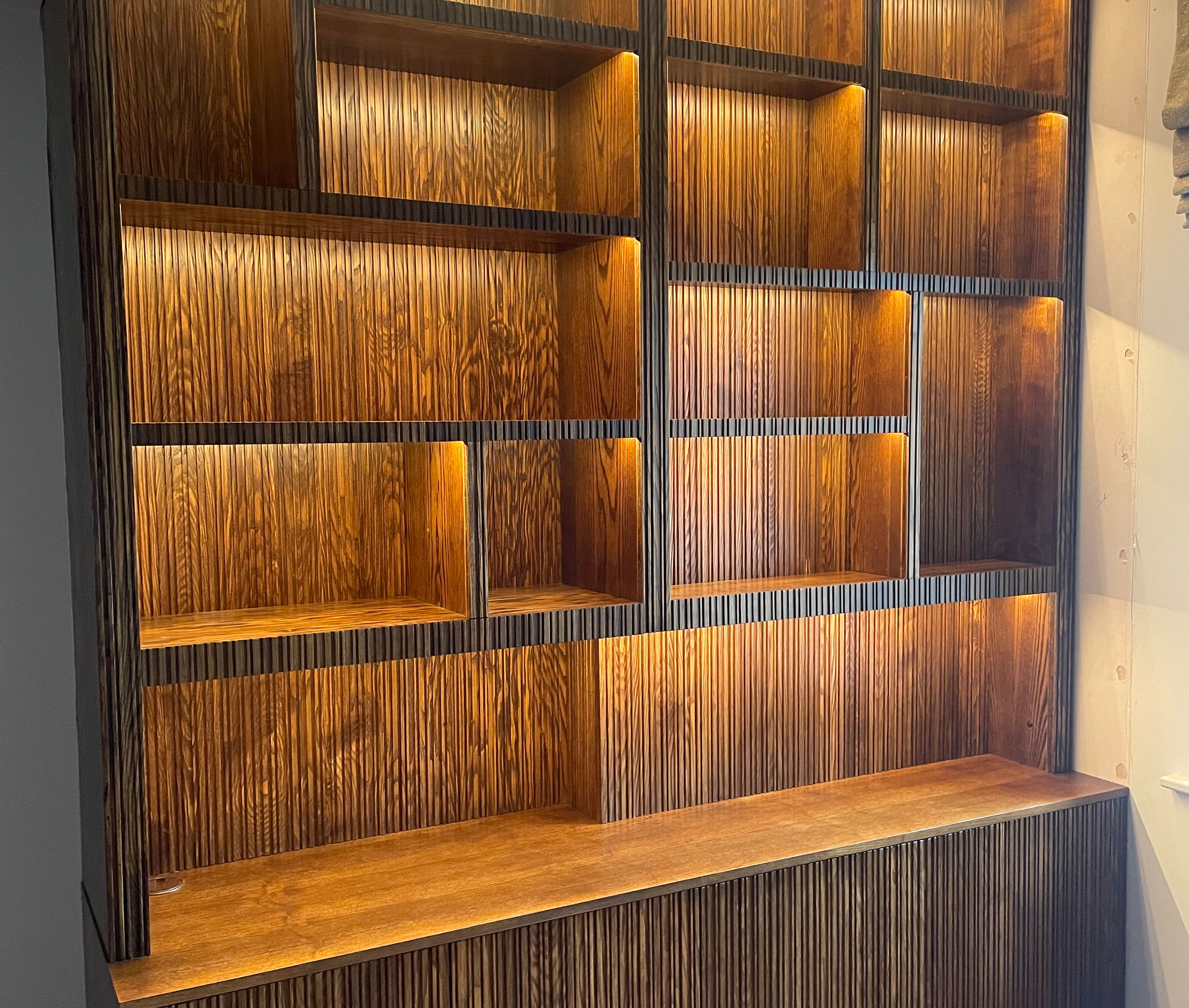 spacedin-ash-office-stained-walnut-naked-shelves-grooved-fascia-working