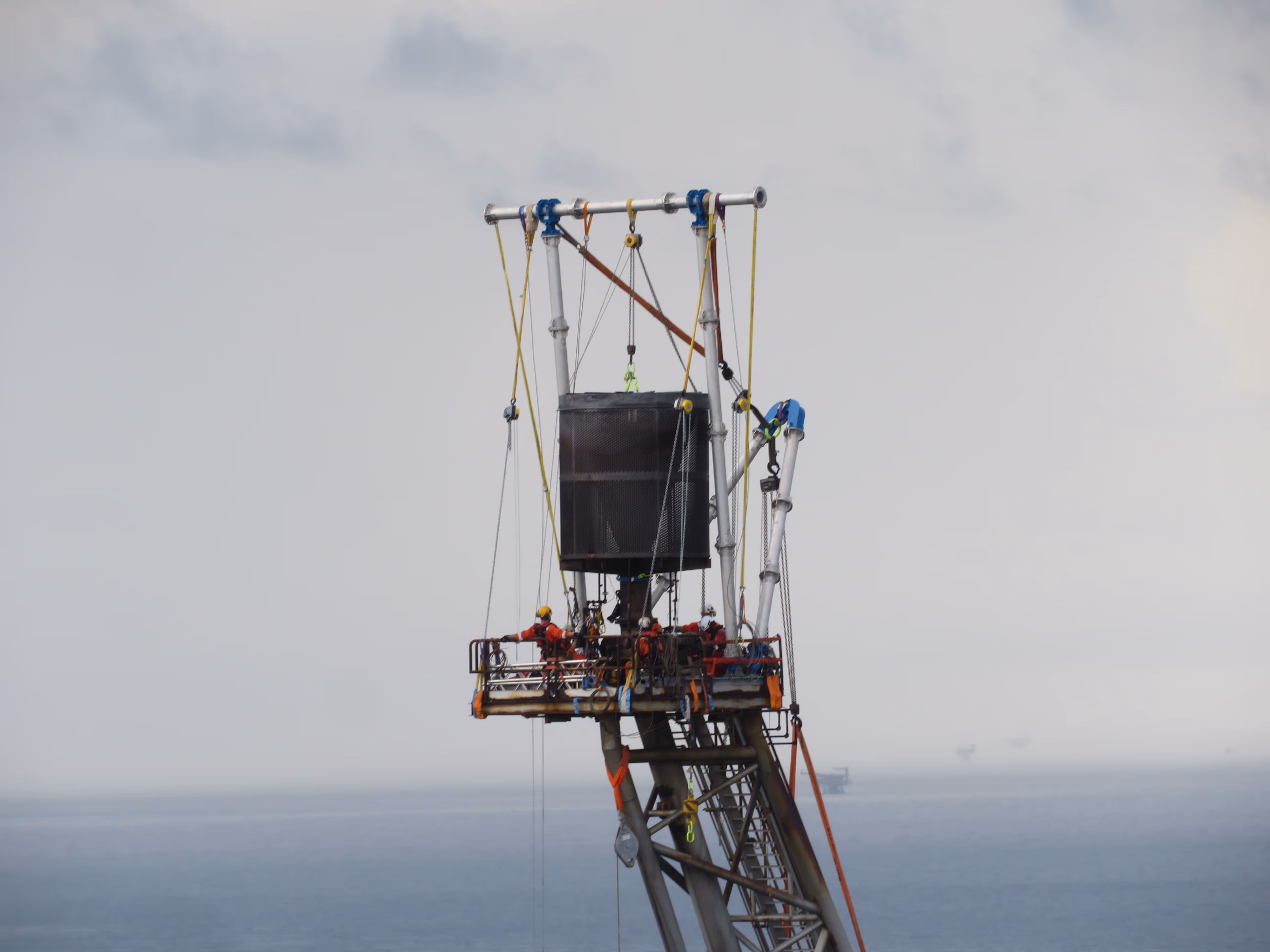 Conbit rope access technicians are preparing the flare tip for removal during a flare to vent conversion project. This project ook place offshore Malaysia. A mechanical handling method is used to replace parts of the flare tower.