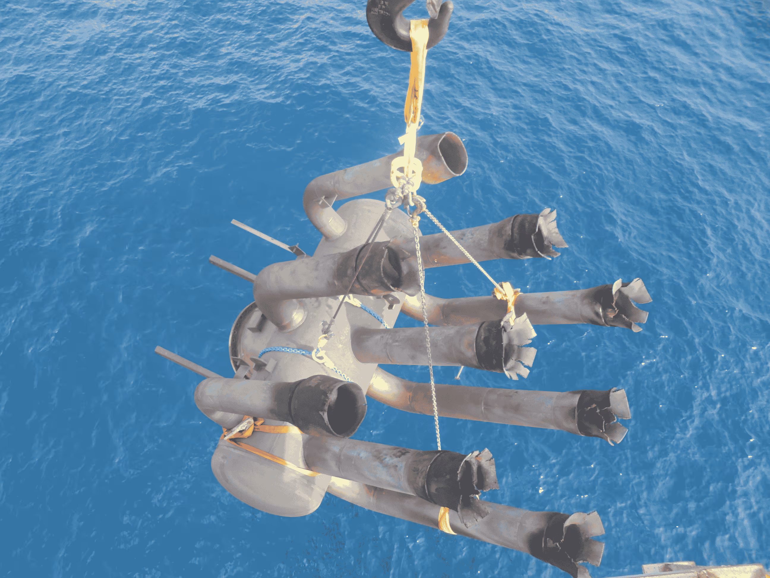 "Flare tip carefully lowered from the bridge and transferred to a supply vessel using high-speed winches, ensuring safe transportation to shore for replacement operations."