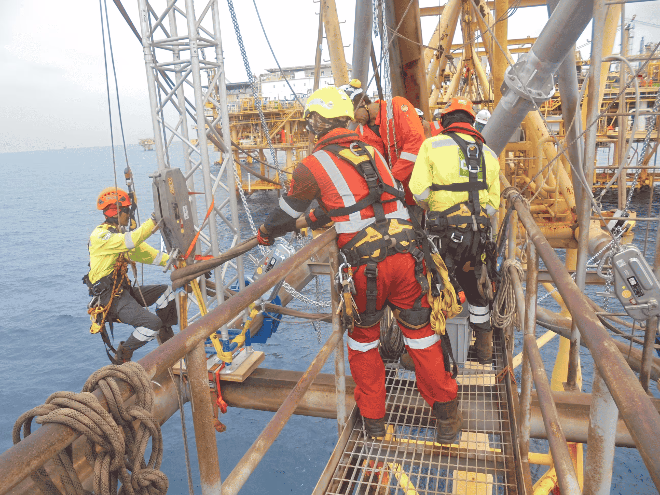 "CR3 rope access and mechanical technicians work in tandem with Conbit specialists to execute the flare tip replacement at the Erawan facility, showcasing teamwork and expertise."
