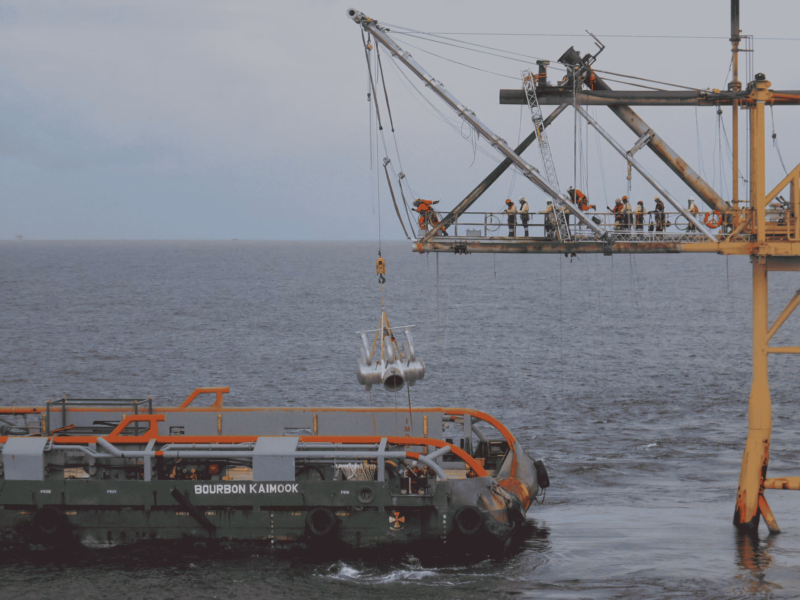 "Flare tip carefully lowered from the bridge and transferred to a supply vessel using high-speed winches, ensuring safe transportation to shore for replacement operations."