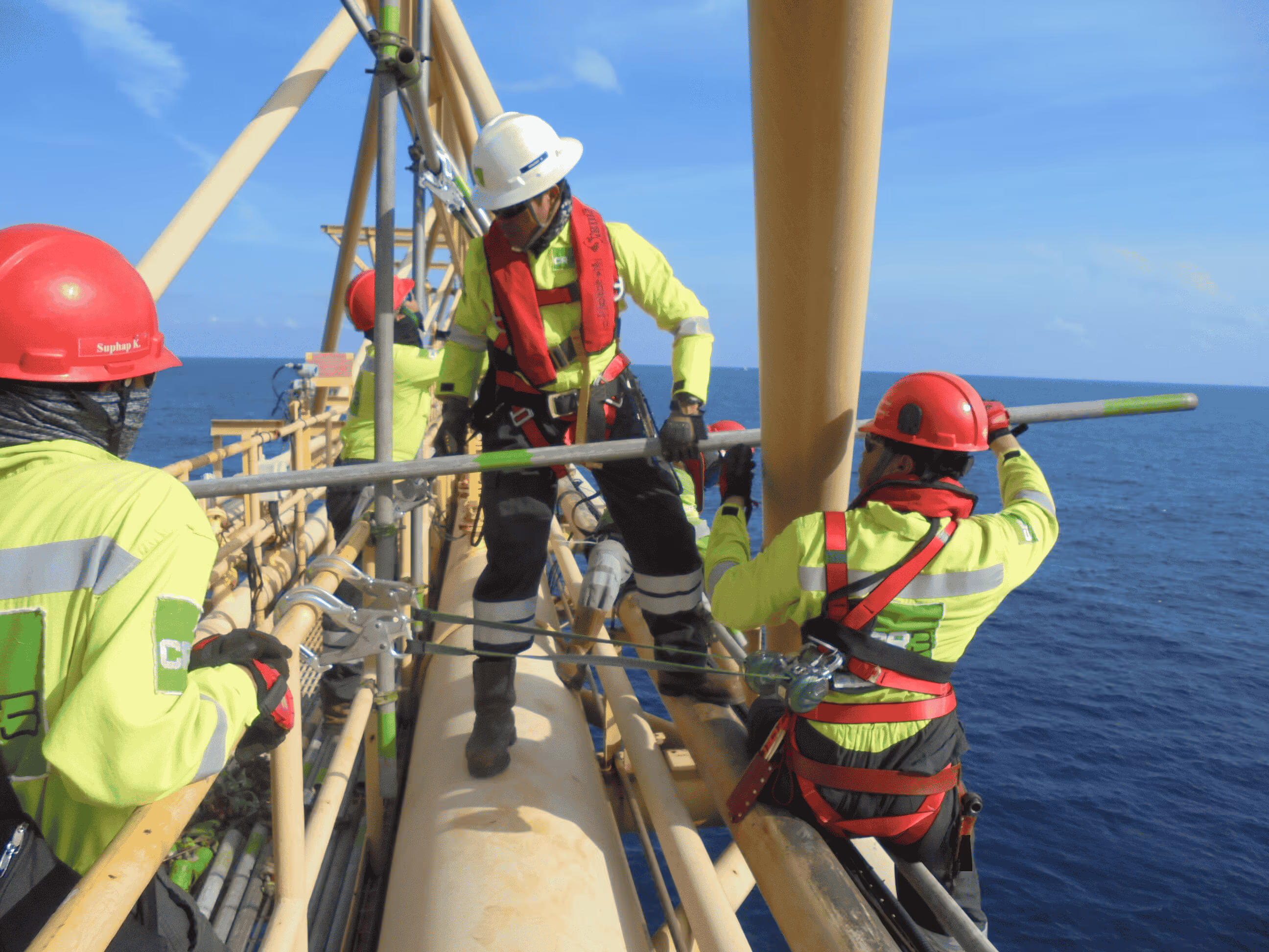 "CR3 rope access and mechanical technicians work in tandem with Conbit specialists to execute the flare tip replacement at the Erawan facility, showcasing teamwork and expertise."
