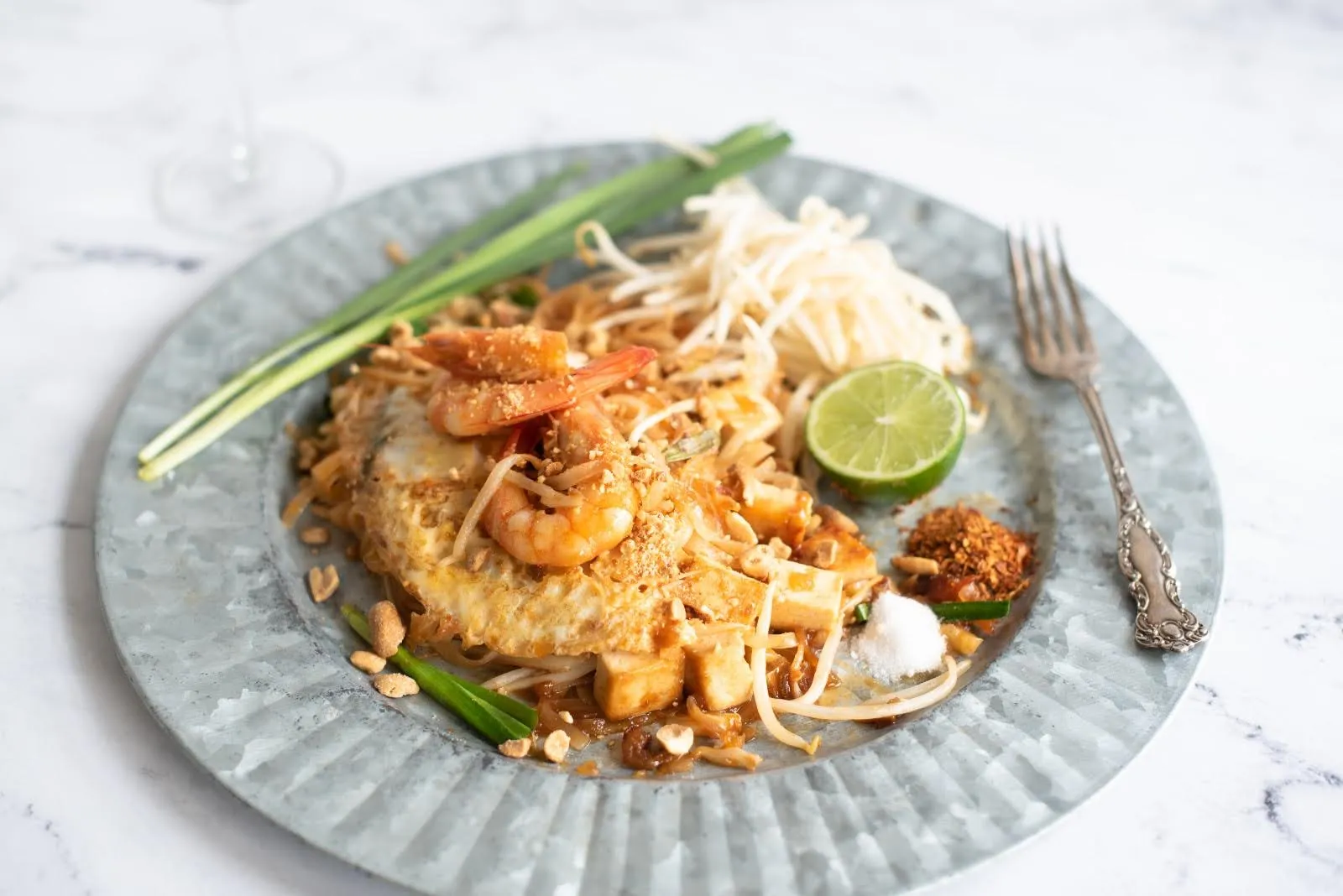 pad thai on a plate at a cooking class