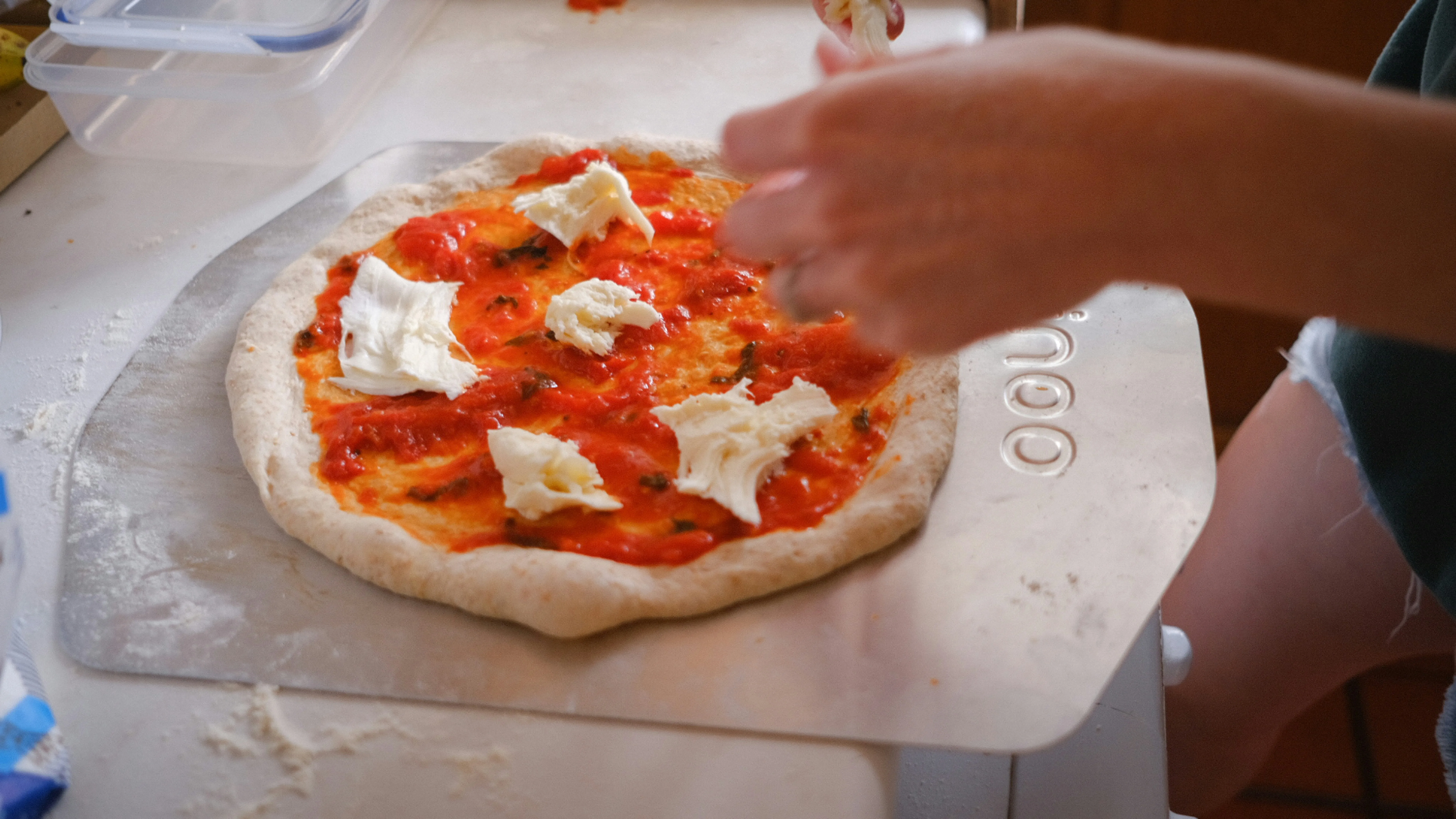 person making pizza  at BiteUnite