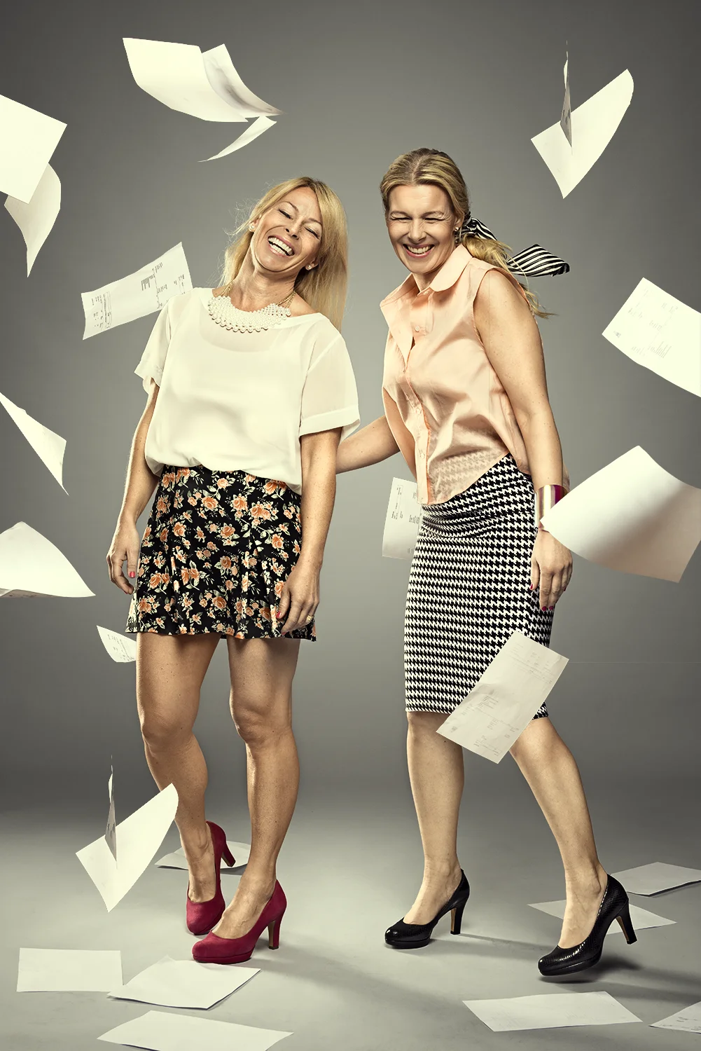 Pair of black work boots hanging in the air in an industrial setting