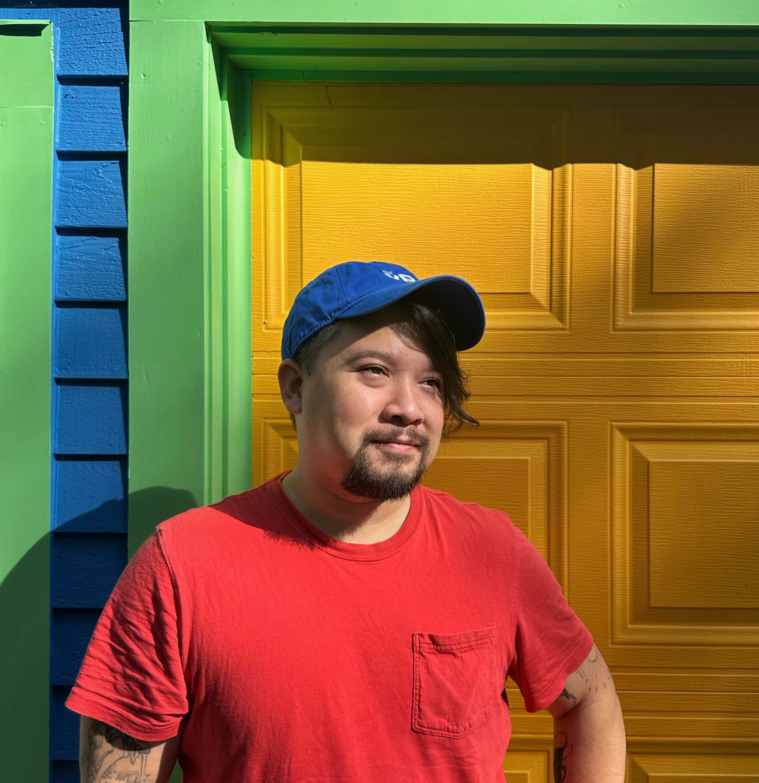 Eric Trieu In front of a colorful building