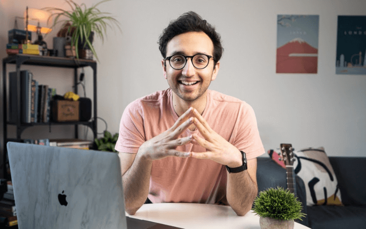 man sitting and talking to camera