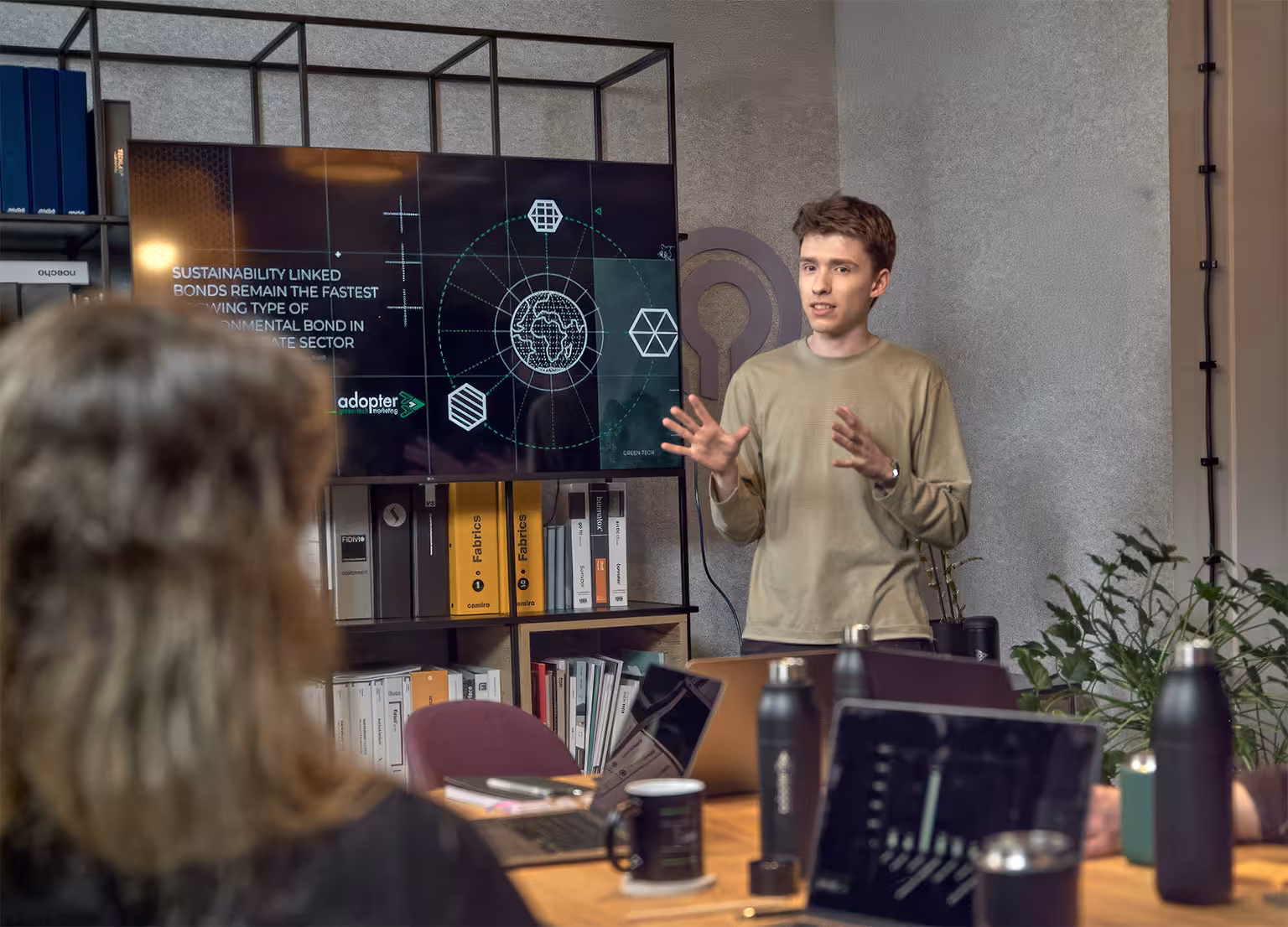 Tim Carney, Account Manager at Adopter green tech marketing agency, presenting sustainability-linked bonds and ESG investment trends to climate tech client