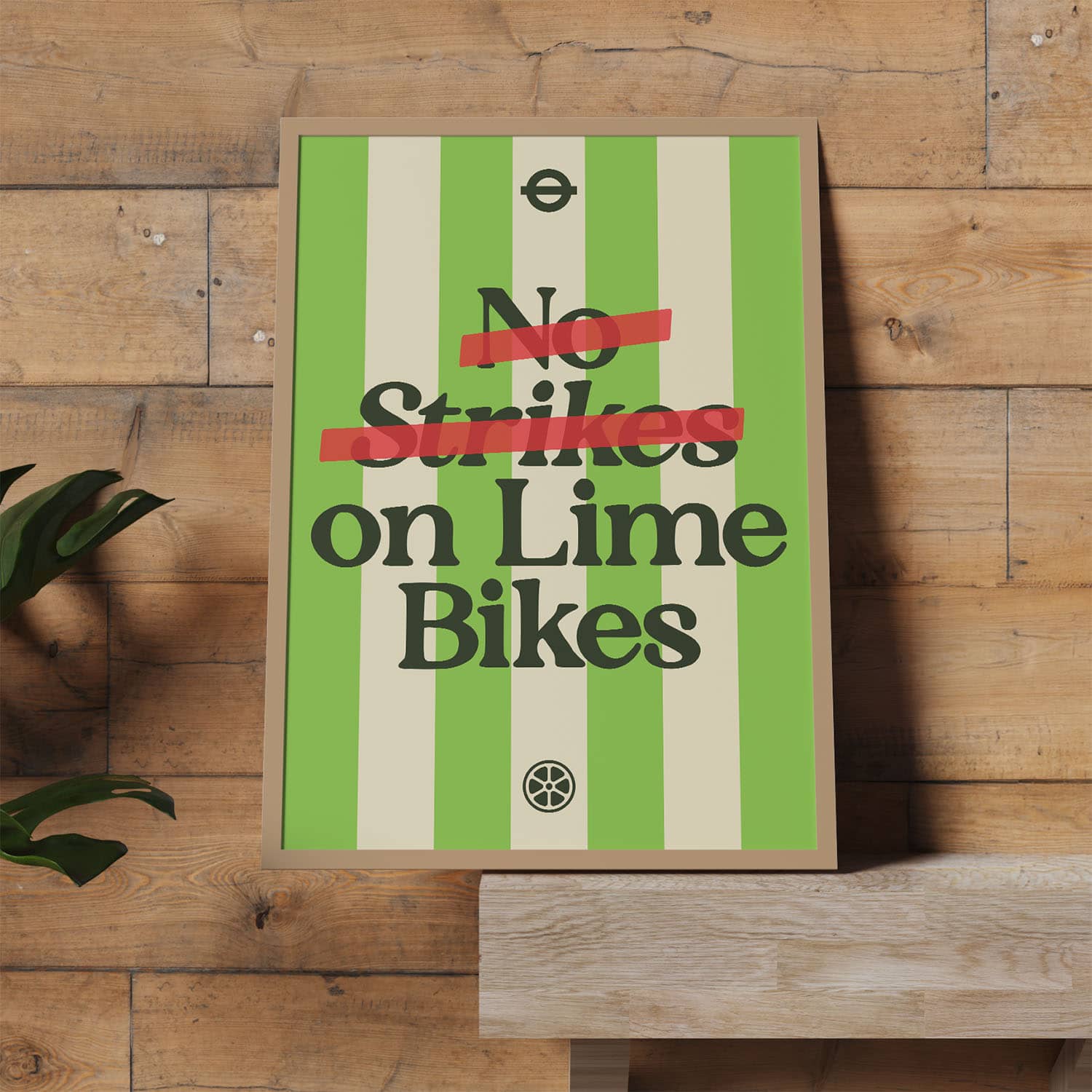Green and cream striped poster reading “No Strikes on Lime Bikes,” with the word “Strikes” crossed out in red.