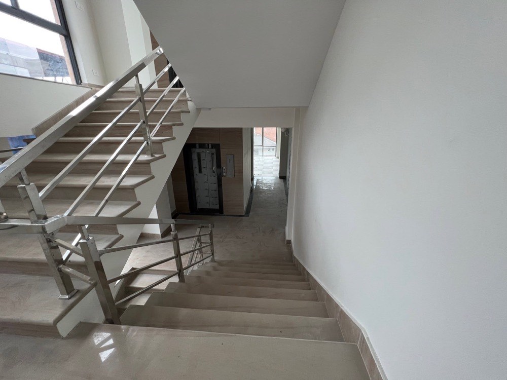 Marble stair and lift lobby at OneSky