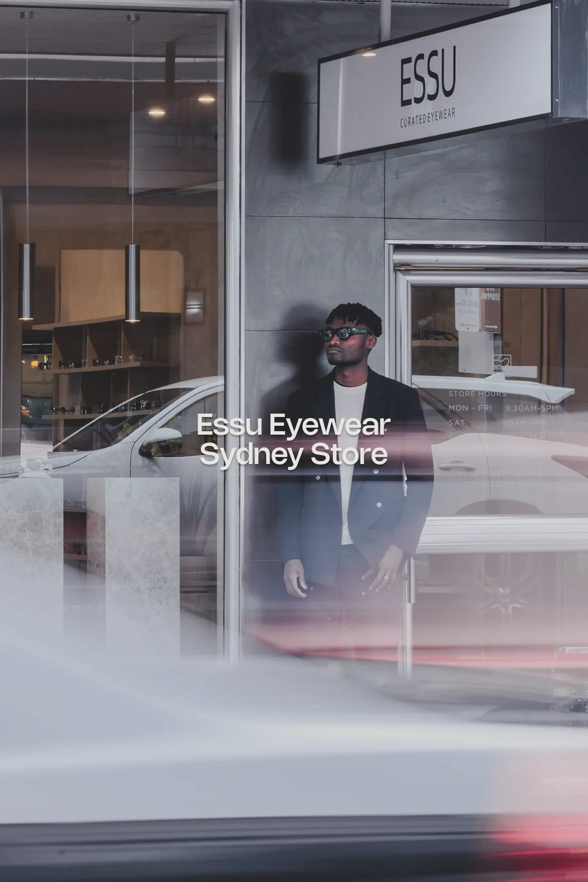 Close-up of minimalist wooden display shelves at ESSU Eyewear in Sydney, showcasing a variety of designer sunglasses and optical frames, including styles by Lapima