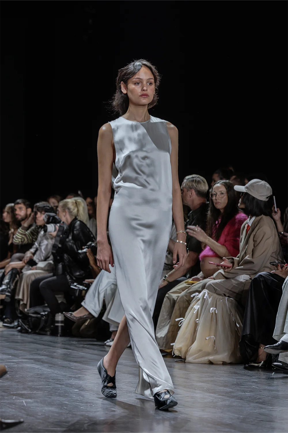 Model in a sleek, ivory silk slip dress with a minimalist silhouette walks the Beare Park runway at Australian Fashion Week 2025.