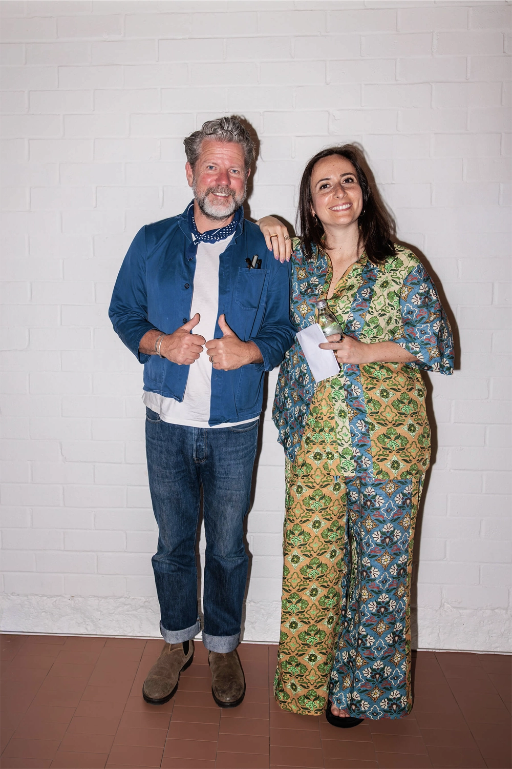 Tim Ross and Nasim Koerting smile for a portrait after speaking at the “I’ll Be Happy When” event hosted by DesignByThem.