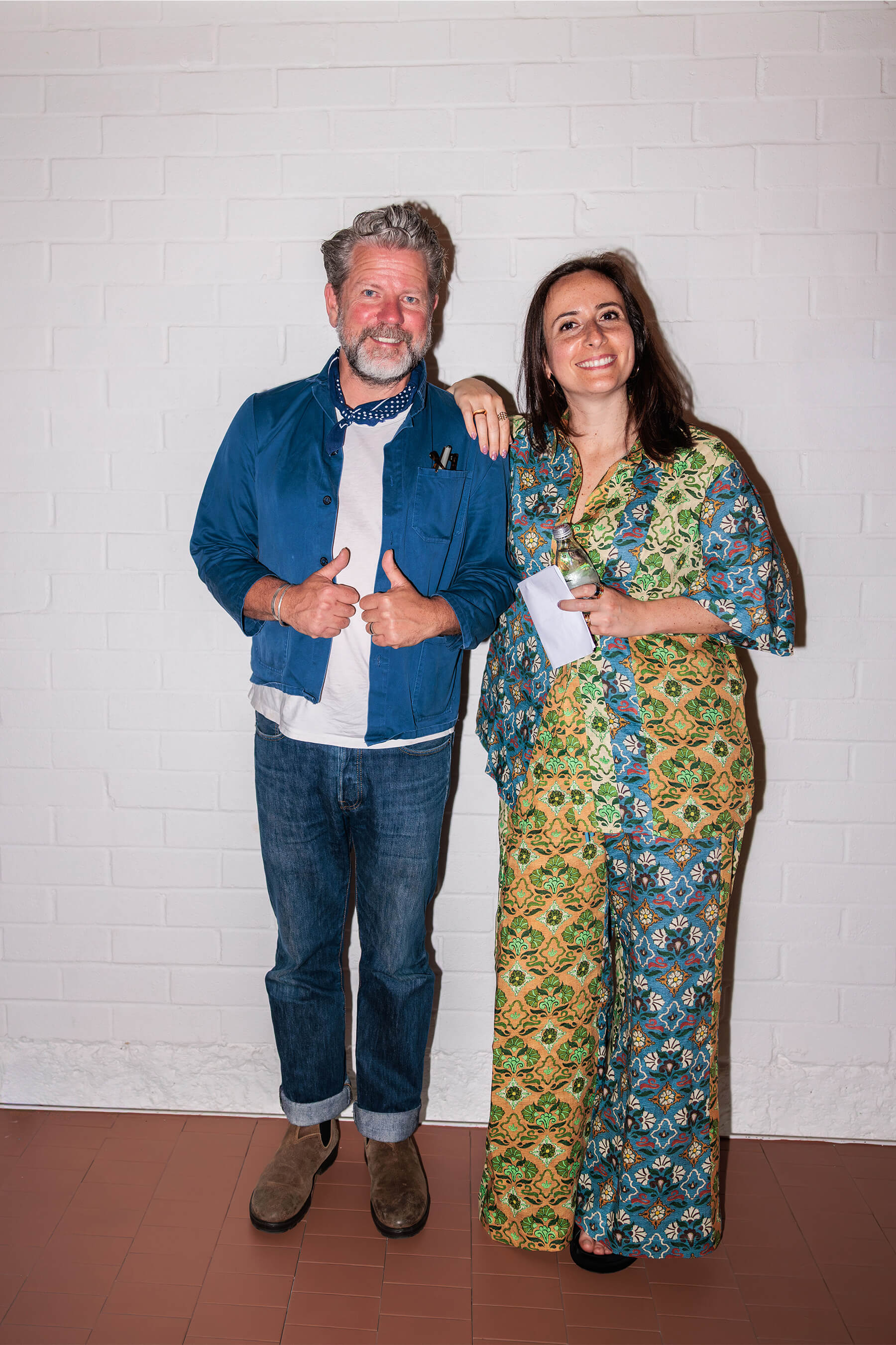 Tim Ross and Nasim Koerting smile for a portrait after speaking at the “I’ll Be Happy When” event hosted by DesignByThem.