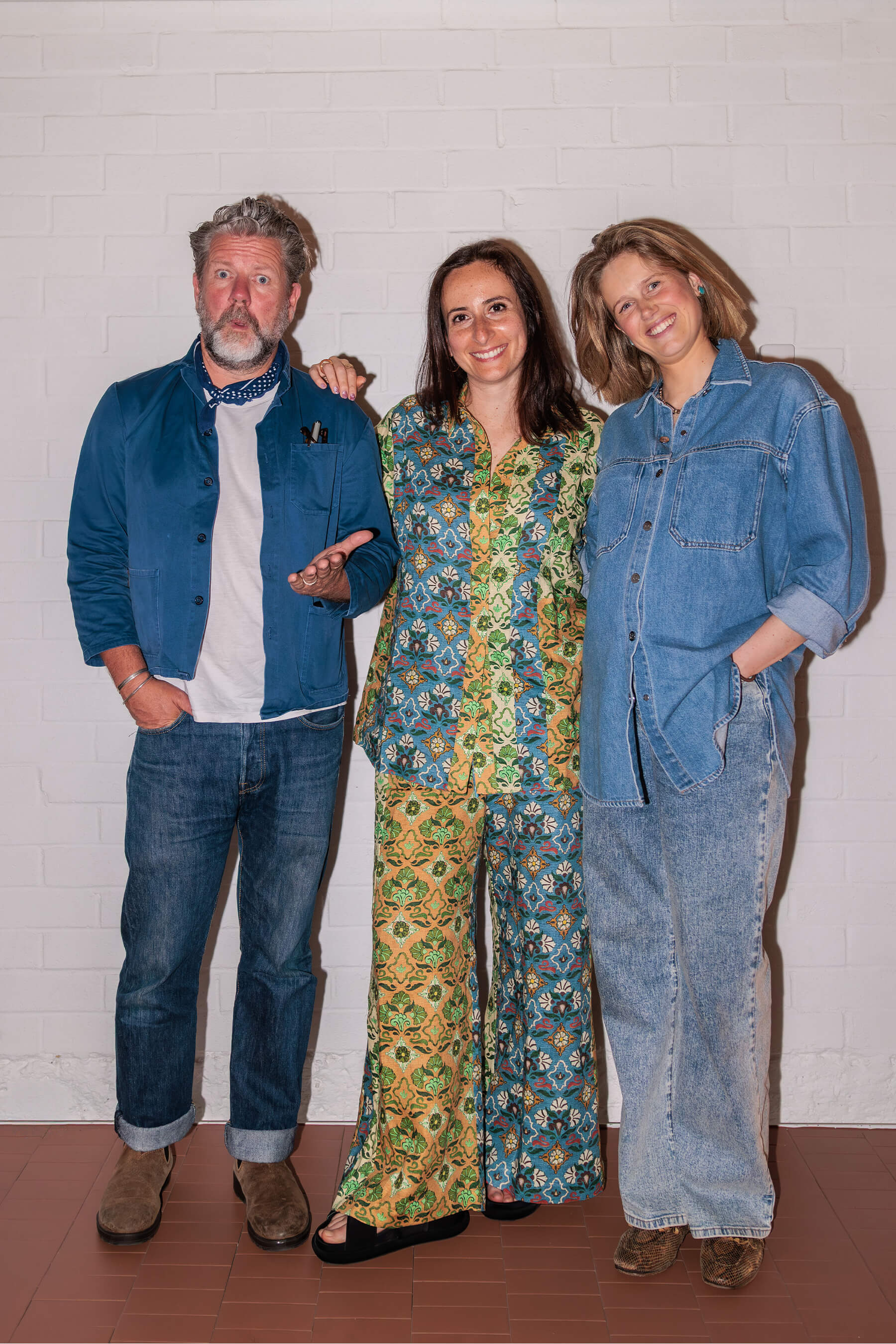 DesignByThem panelists, Tim Ross, Eliza Gosse, and Nasim Koerting, photographed against a white studio wall post-event.
