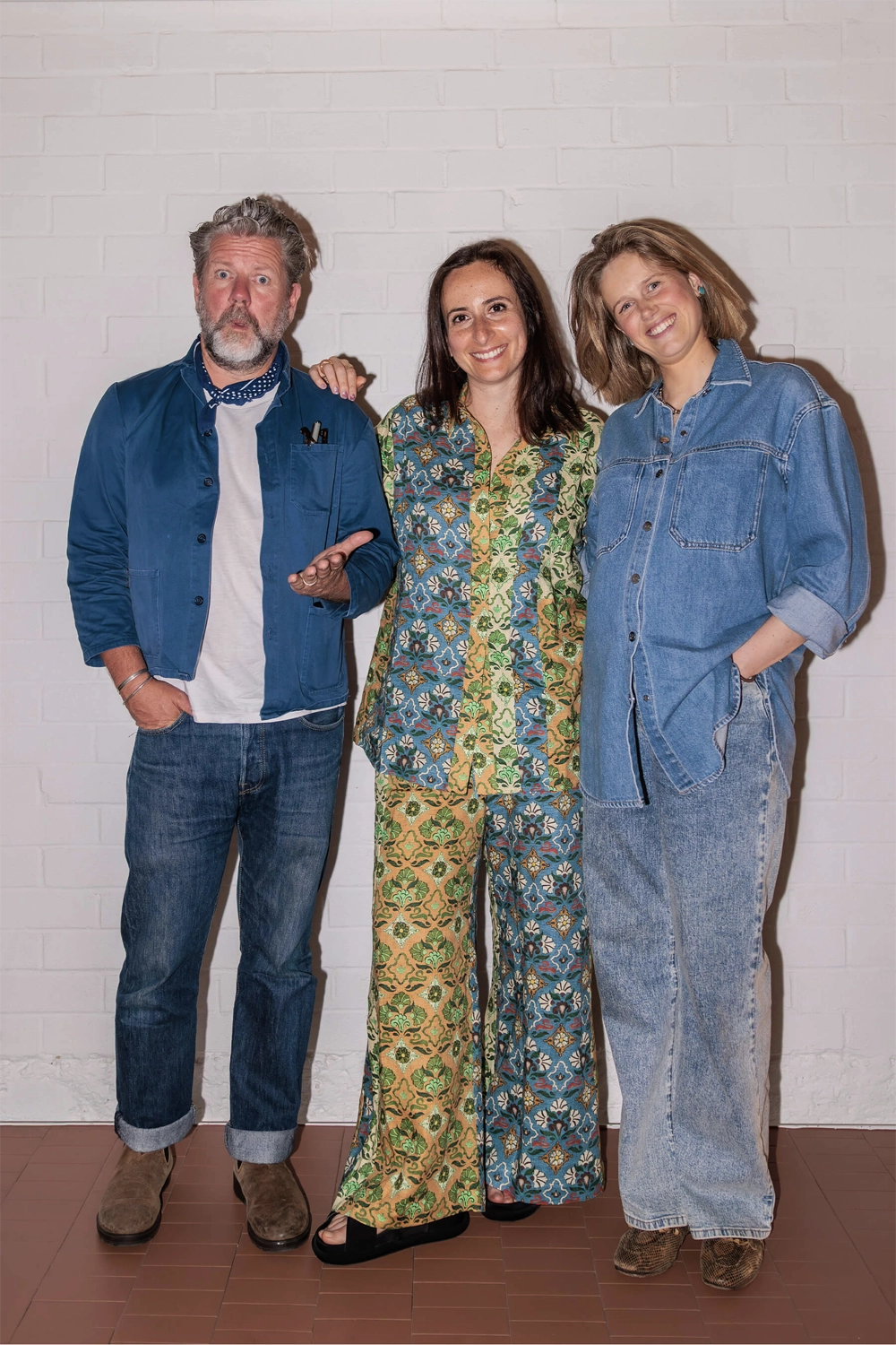 DesignByThem panelists, Tim Ross, Eliza Gosse, and Nasim Koerting, photographed against a white studio wall post-event.