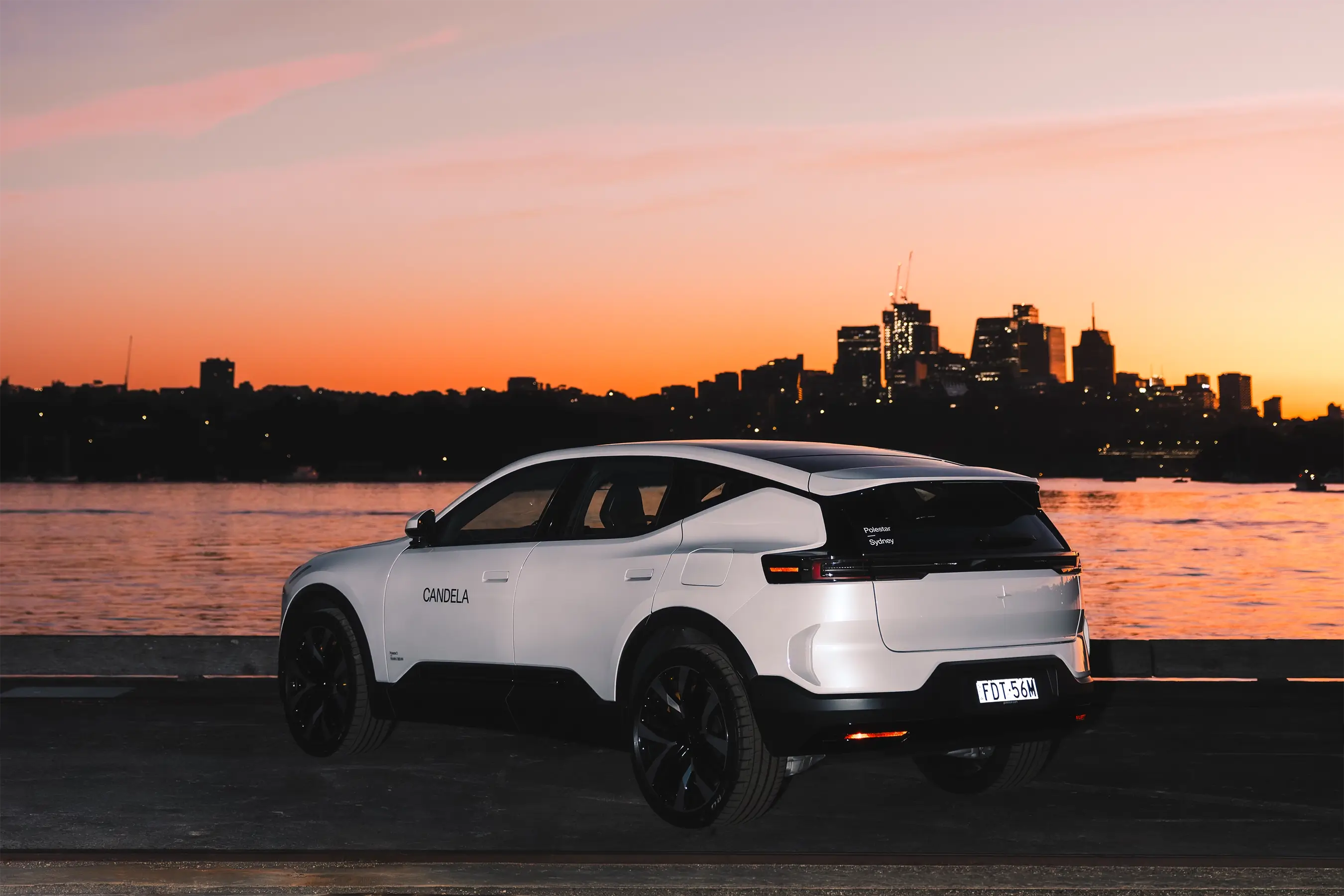 Polestar and Candela collaboration captured at Sydney Harbour Concours d’Elegance, featuring the Candela C-8 Polestar edition electric hydrofoil boat alongside Polestar vehicles, photographed by EDG Studios.