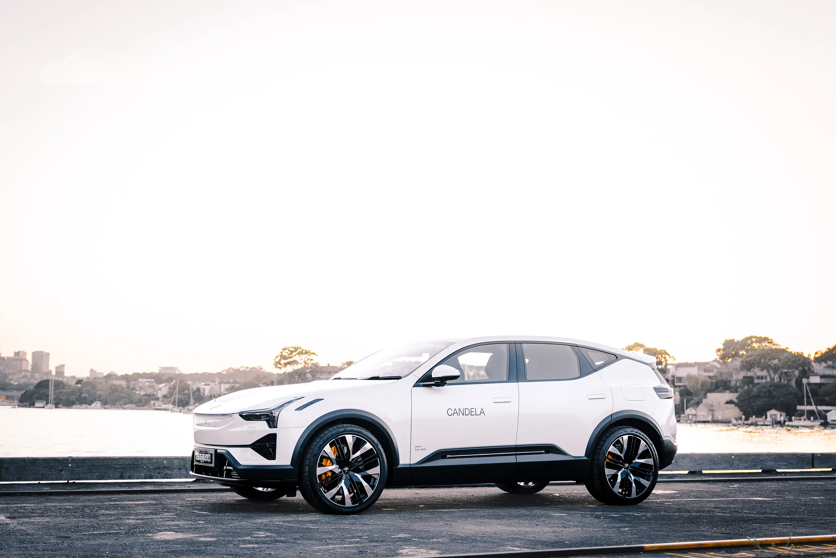 Polestar and Candela collaboration captured at Sydney Harbour Concours d’Elegance, featuring the Candela C-8 Polestar edition electric hydrofoil boat alongside Polestar vehicles, photographed by EDG Studios.
