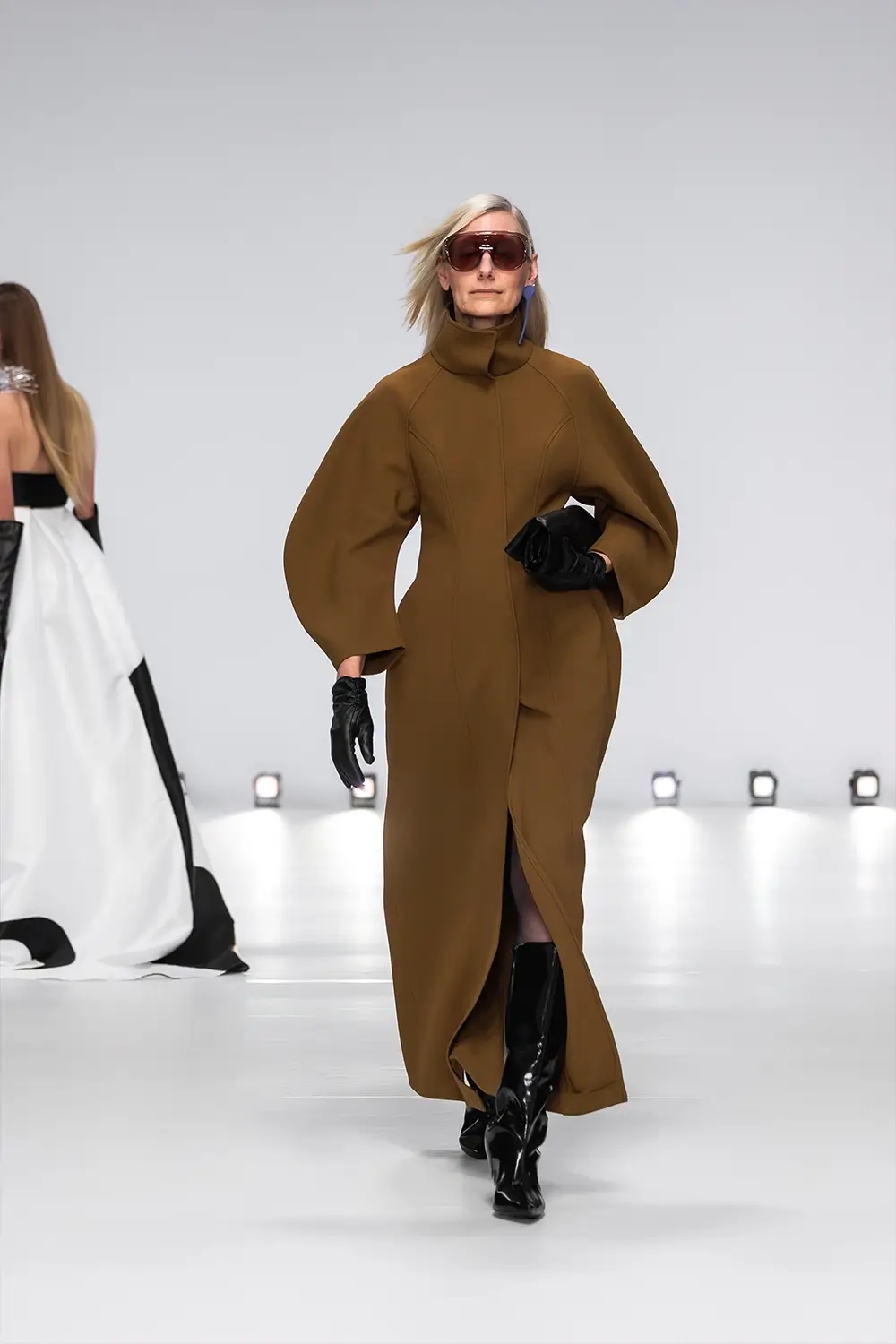 Mariam Seddiq ‘Echoes’ runway show photographed at Australian Fashion Week 2026, featuring sculptural silhouettes, elevated tailoring, leather detailing and contemporary Australian fashion captured in an editorial runway setting.