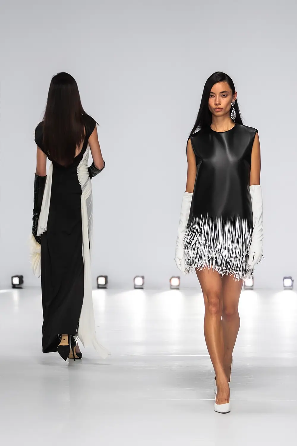 Mariam Seddiq ‘Echoes’ runway show photographed at Australian Fashion Week 2026, featuring sculptural silhouettes, elevated tailoring, leather detailing and contemporary Australian fashion captured in an editorial runway setting.