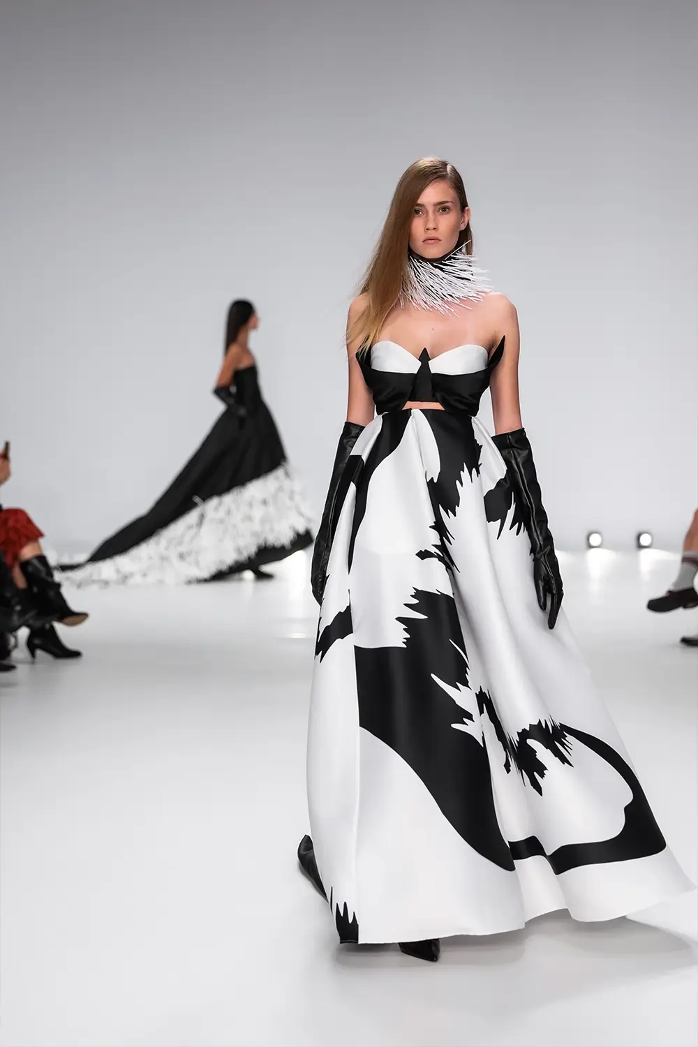 Mariam Seddiq ‘Echoes’ runway show photographed at Australian Fashion Week 2026, featuring sculptural silhouettes, elevated tailoring, leather detailing and contemporary Australian fashion captured in an editorial runway setting.