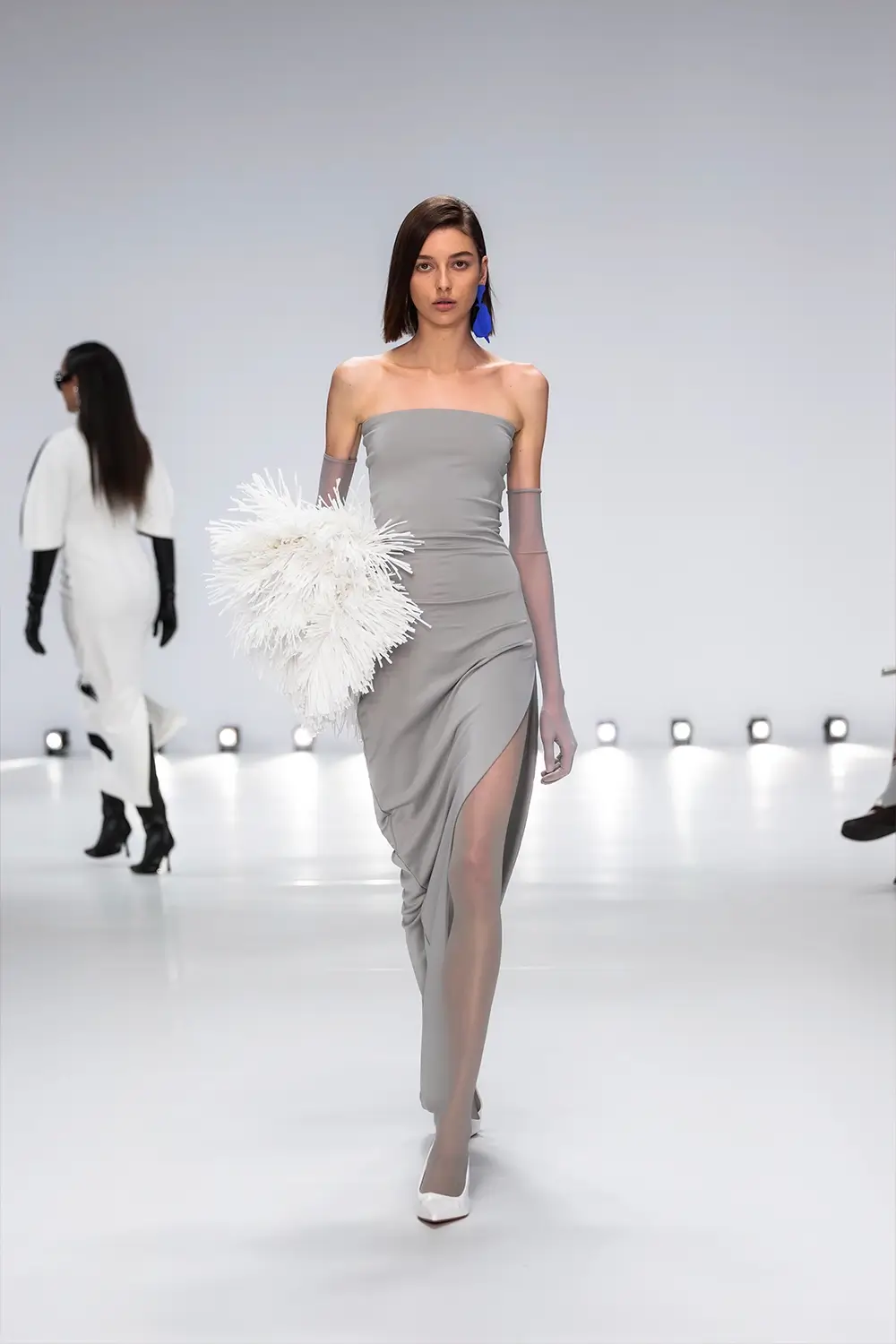 Mariam Seddiq ‘Echoes’ runway show photographed at Australian Fashion Week 2026, featuring sculptural silhouettes, elevated tailoring, leather detailing and contemporary Australian fashion captured in an editorial runway setting.