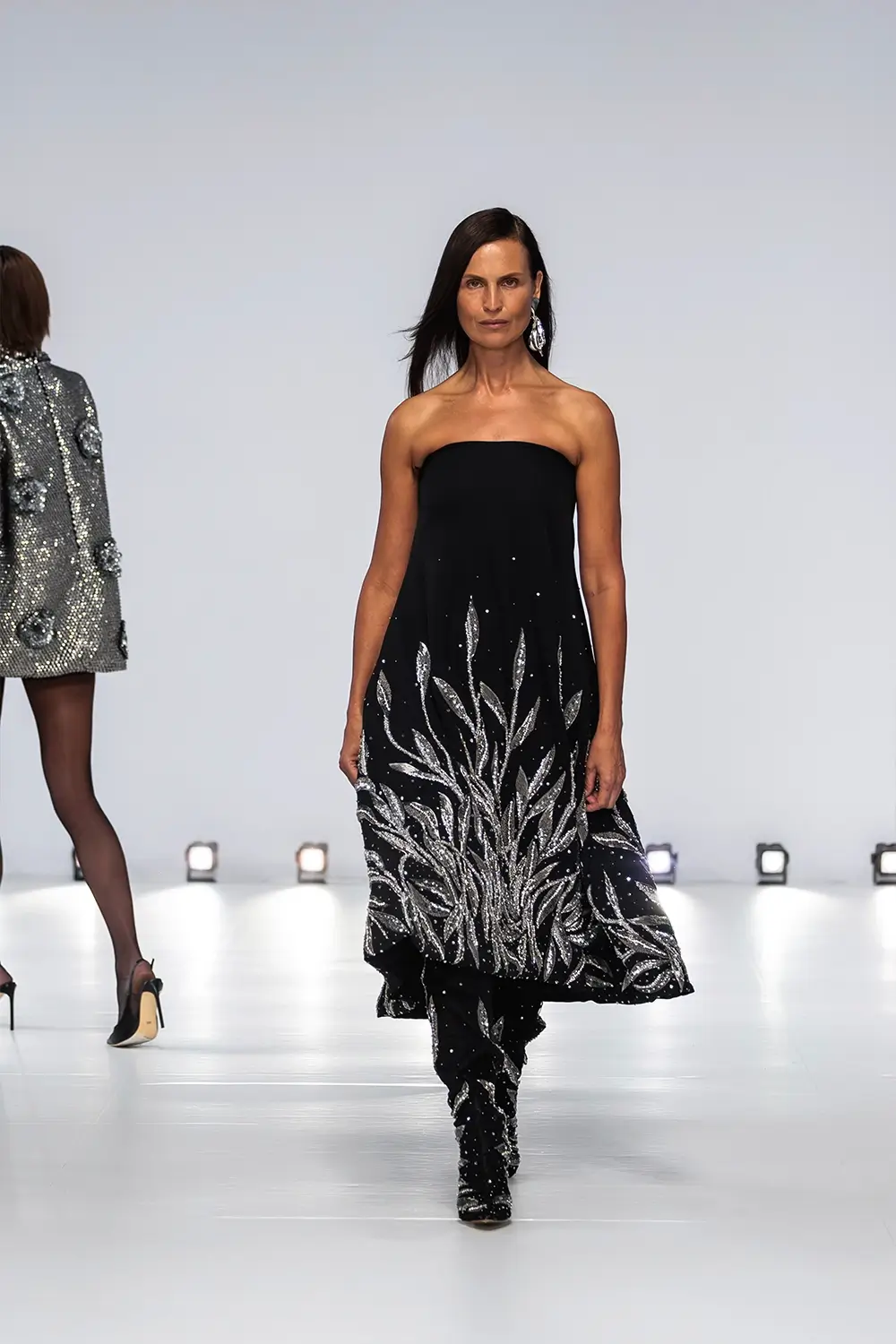 Mariam Seddiq ‘Echoes’ runway show photographed at Australian Fashion Week 2026, featuring sculptural silhouettes, elevated tailoring, leather detailing and contemporary Australian fashion captured in an editorial runway setting.