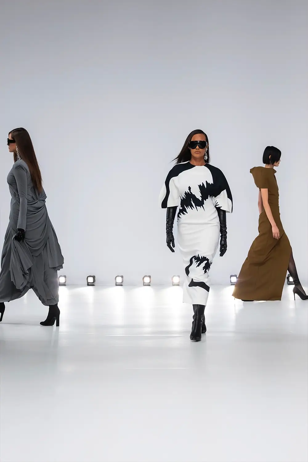 Mariam Seddiq ‘Echoes’ runway show photographed at Australian Fashion Week 2026, featuring sculptural silhouettes, elevated tailoring, leather detailing and contemporary Australian fashion captured in an editorial runway setting.