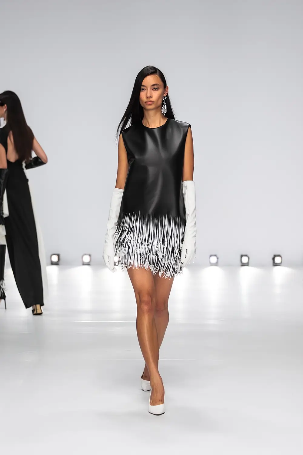 Mariam Seddiq ‘Echoes’ runway show photographed at Australian Fashion Week 2026, featuring sculptural silhouettes, elevated tailoring, leather detailing and contemporary Australian fashion captured in an editorial runway setting.