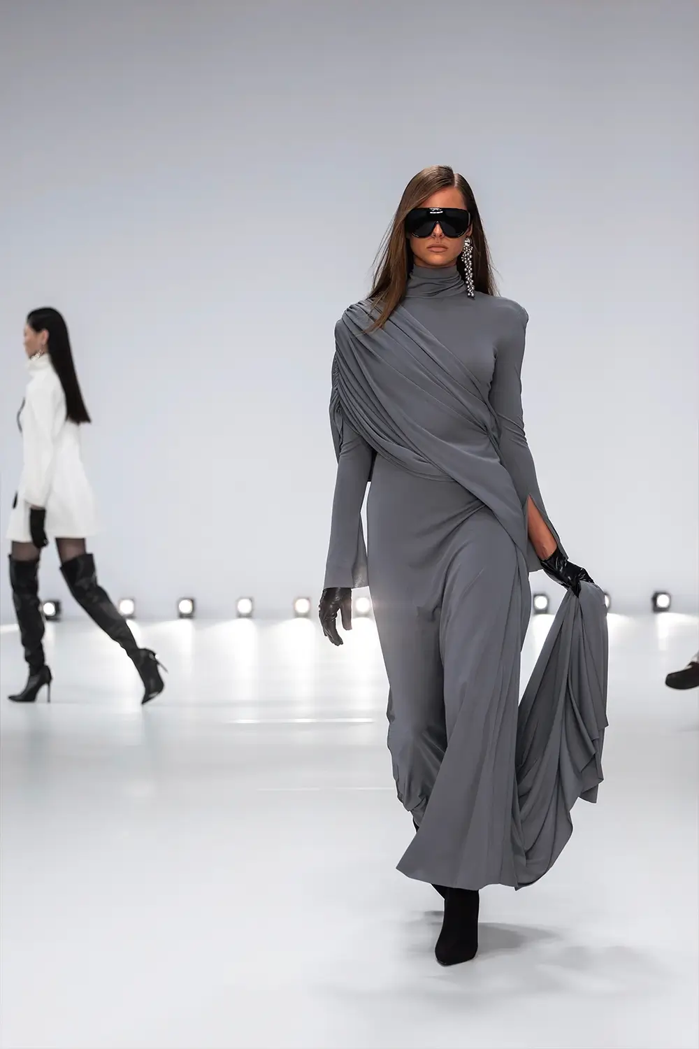 Mariam Seddiq ‘Echoes’ runway show photographed at Australian Fashion Week 2026, featuring sculptural silhouettes, elevated tailoring, leather detailing and contemporary Australian fashion captured in an editorial runway setting.