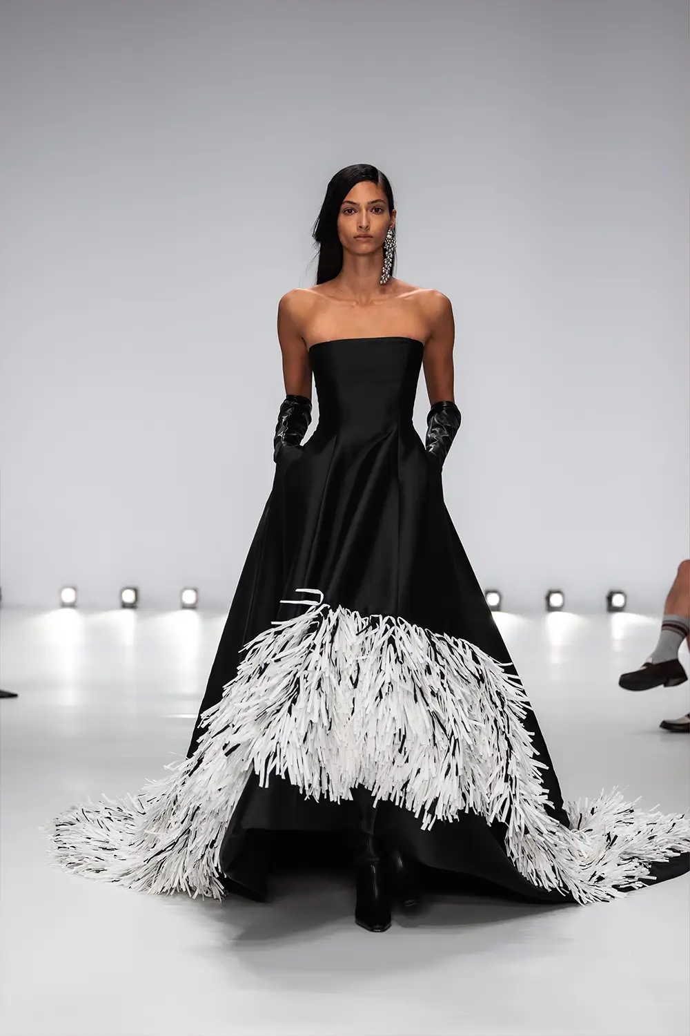 Mariam Seddiq ‘Echoes’ runway show photographed at Australian Fashion Week 2026, featuring sculptural silhouettes, elevated tailoring, leather detailing and contemporary Australian fashion captured in an editorial runway setting.
