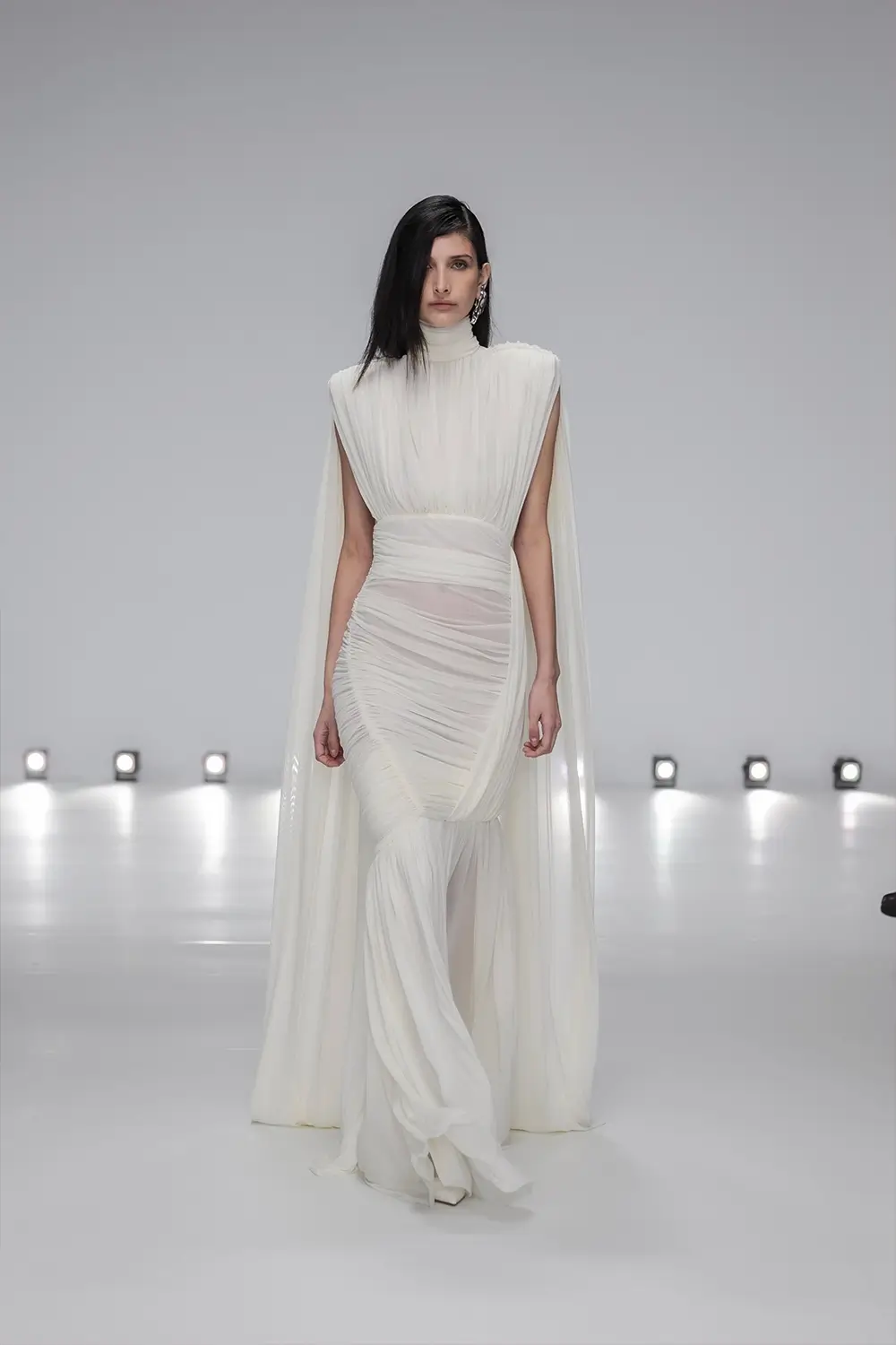 Mariam Seddiq ‘Echoes’ runway show photographed at Australian Fashion Week 2026, featuring sculptural silhouettes, elevated tailoring, leather detailing and contemporary Australian fashion captured in an editorial runway setting.