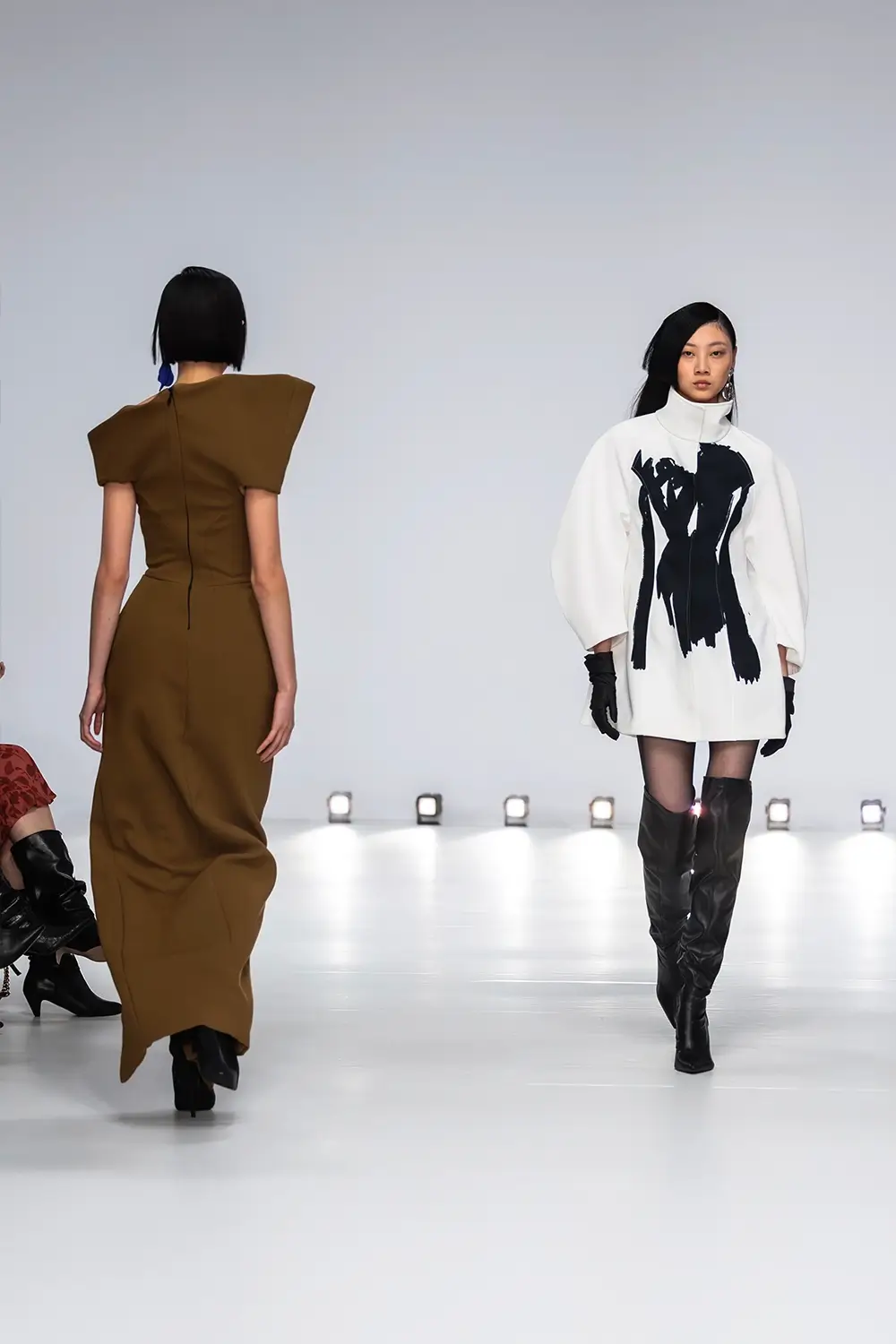 Mariam Seddiq ‘Echoes’ runway show photographed at Australian Fashion Week 2026, featuring sculptural silhouettes, elevated tailoring, leather detailing and contemporary Australian fashion captured in an editorial runway setting.
