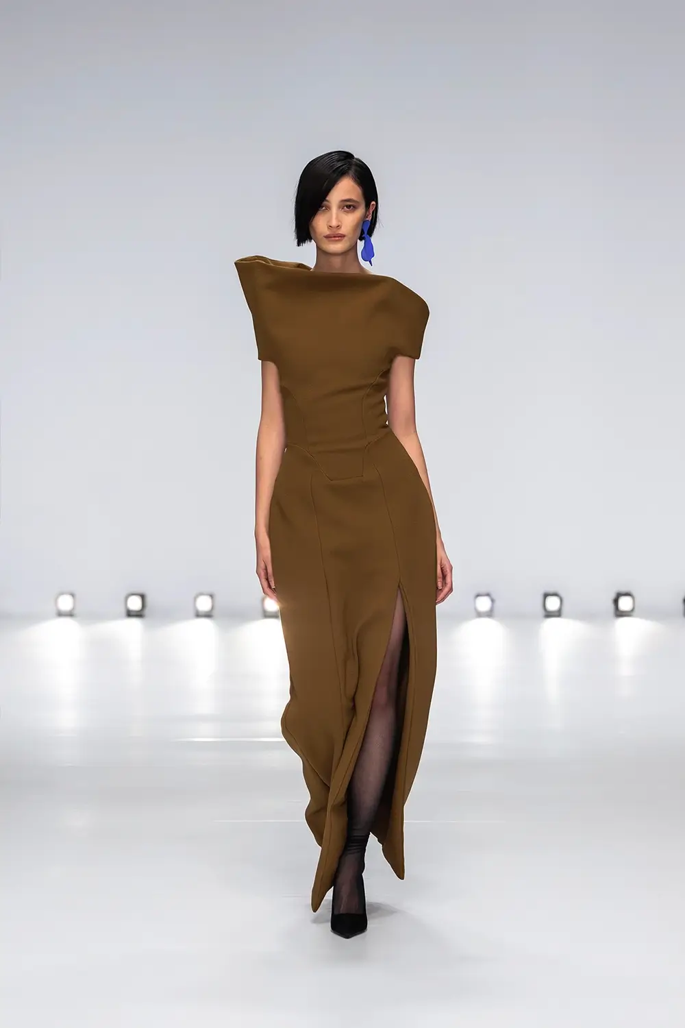 Mariam Seddiq ‘Echoes’ runway show photographed at Australian Fashion Week 2026, featuring sculptural silhouettes, elevated tailoring, leather detailing and contemporary Australian fashion captured in an editorial runway setting.