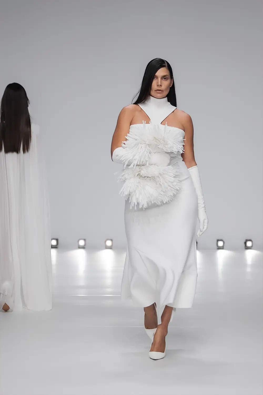 Mariam Seddiq ‘Echoes’ runway show photographed at Australian Fashion Week 2026, featuring sculptural silhouettes, elevated tailoring, leather detailing and contemporary Australian fashion captured in an editorial runway setting.