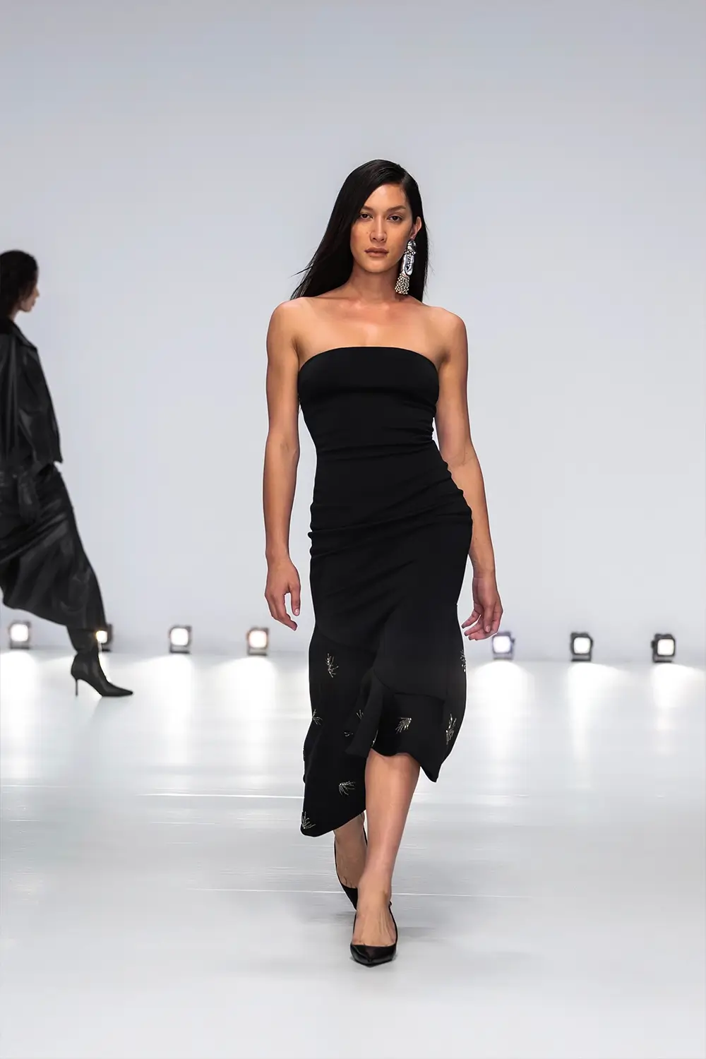 Mariam Seddiq ‘Echoes’ runway show photographed at Australian Fashion Week 2026, featuring sculptural silhouettes, elevated tailoring, leather detailing and contemporary Australian fashion captured in an editorial runway setting.