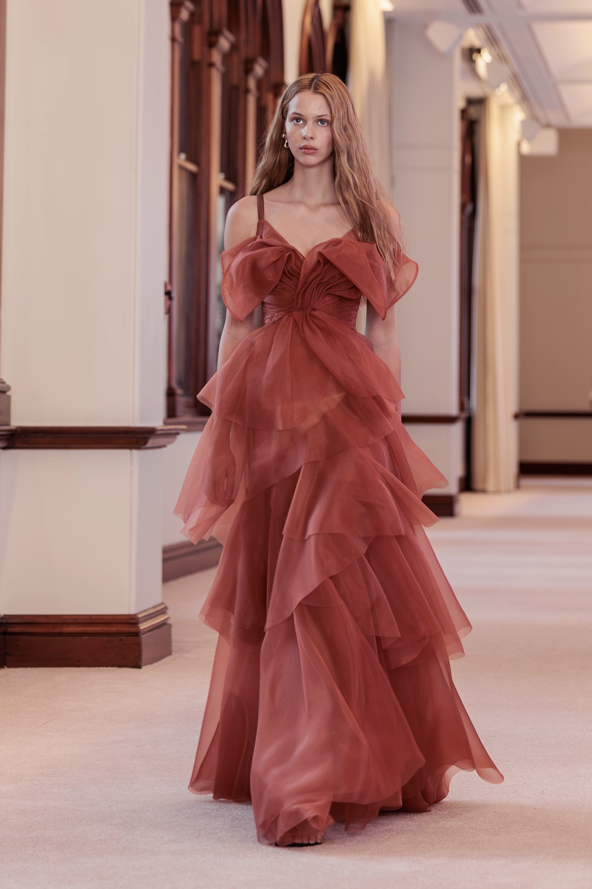 Aje. ‘Siren’ runway show photographed at Australian Fashion Week 2026 at The Lands by Capella Sydney, featuring sculptural resortwear, flowing silhouettes, artisanal textures and contemporary Australian fashion captured in an editorial runway setting.
