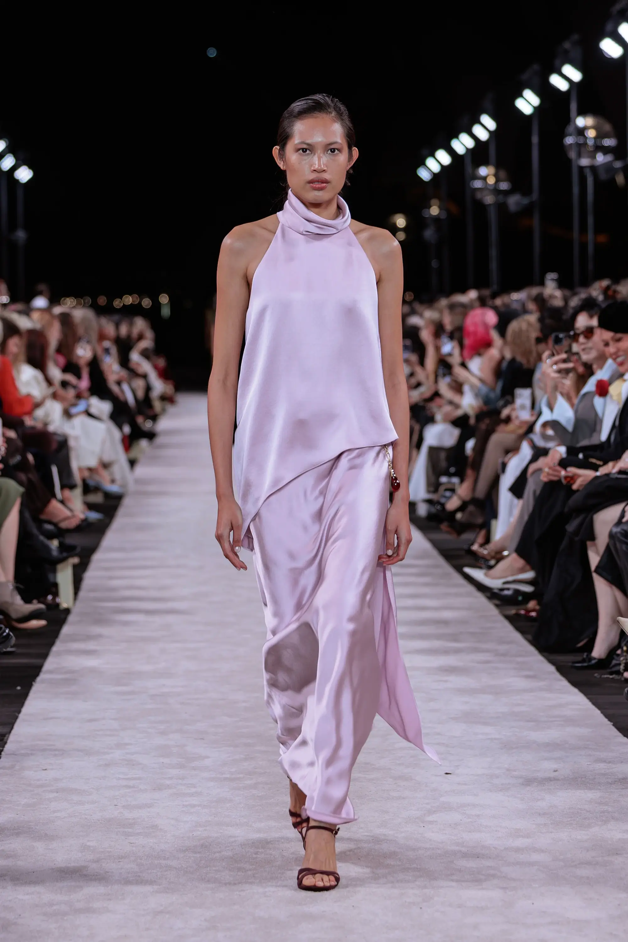 Carla Zampatti ‘Reflections’ runway show photographed at Australian Fashion Week 2026 at the Park Hyatt Sydney Boardwalk, featuring elevated tailoring, fluid silhouettes, shimmering eveningwear and contemporary Australian luxury fashion captured in an editorial runway setting.