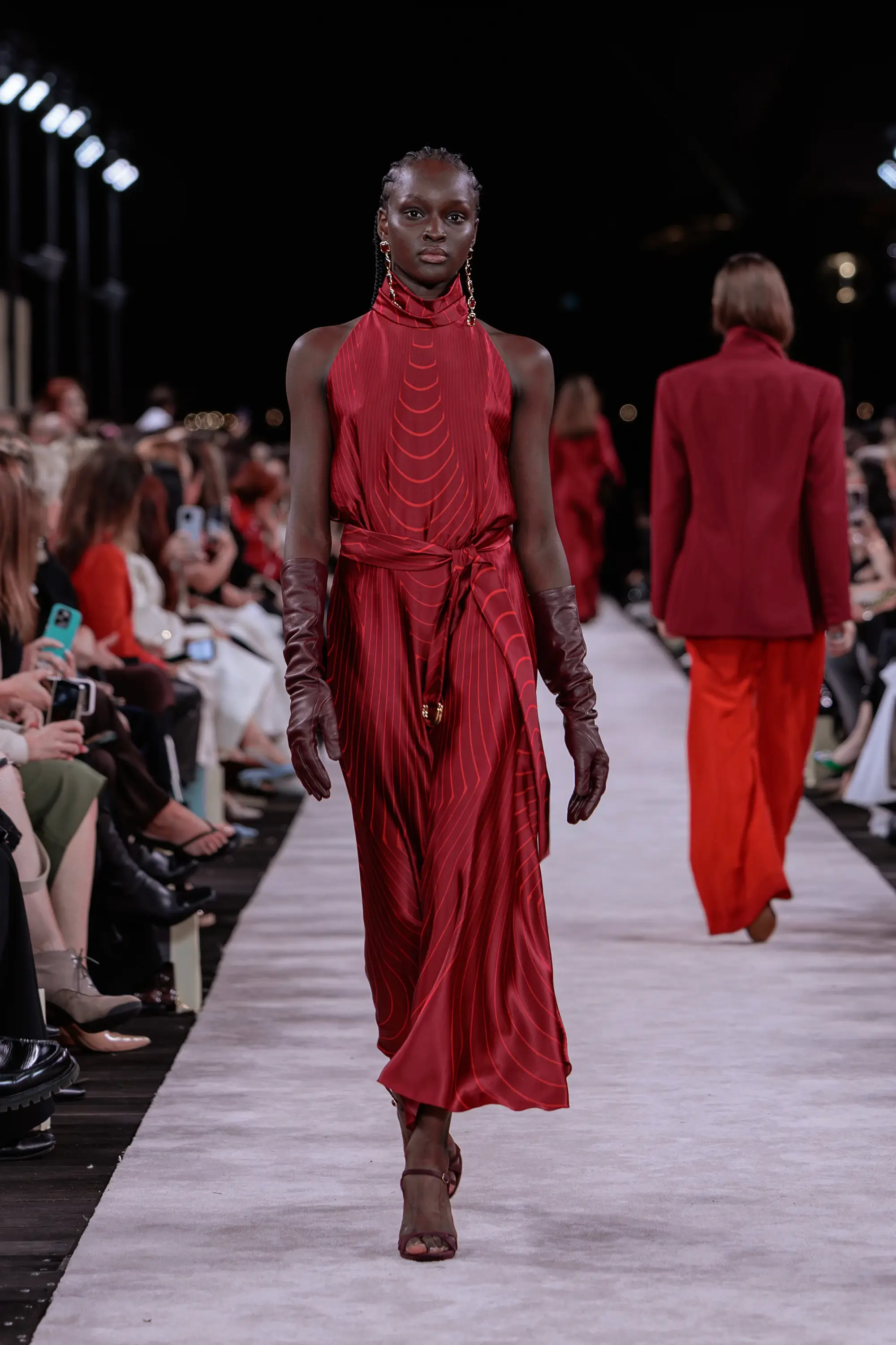 Carla Zampatti ‘Reflections’ runway show photographed at Australian Fashion Week 2026 at the Park Hyatt Sydney Boardwalk, featuring elevated tailoring, fluid silhouettes, shimmering eveningwear and contemporary Australian luxury fashion captured in an editorial runway setting.