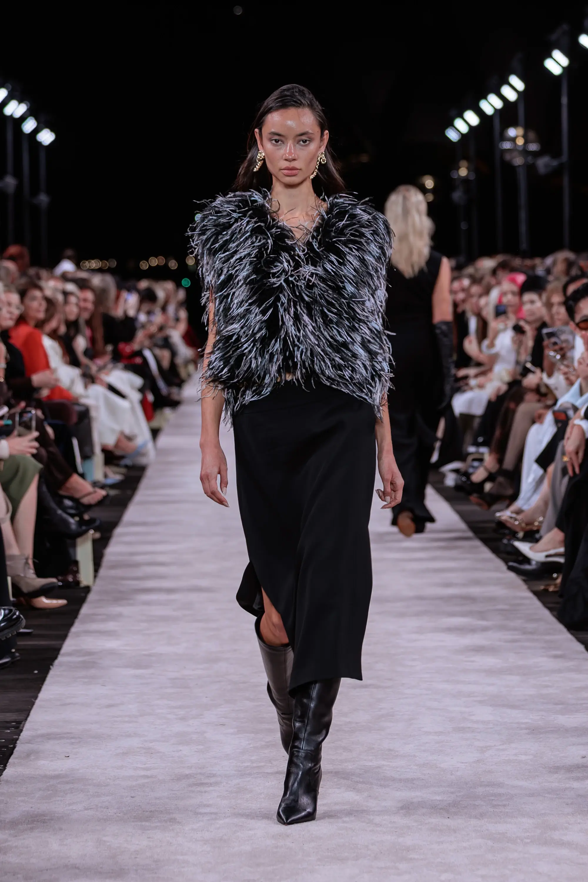 Carla Zampatti ‘Reflections’ runway show photographed at Australian Fashion Week 2026 at the Park Hyatt Sydney Boardwalk, featuring elevated tailoring, fluid silhouettes, shimmering eveningwear and contemporary Australian luxury fashion captured in an editorial runway setting.